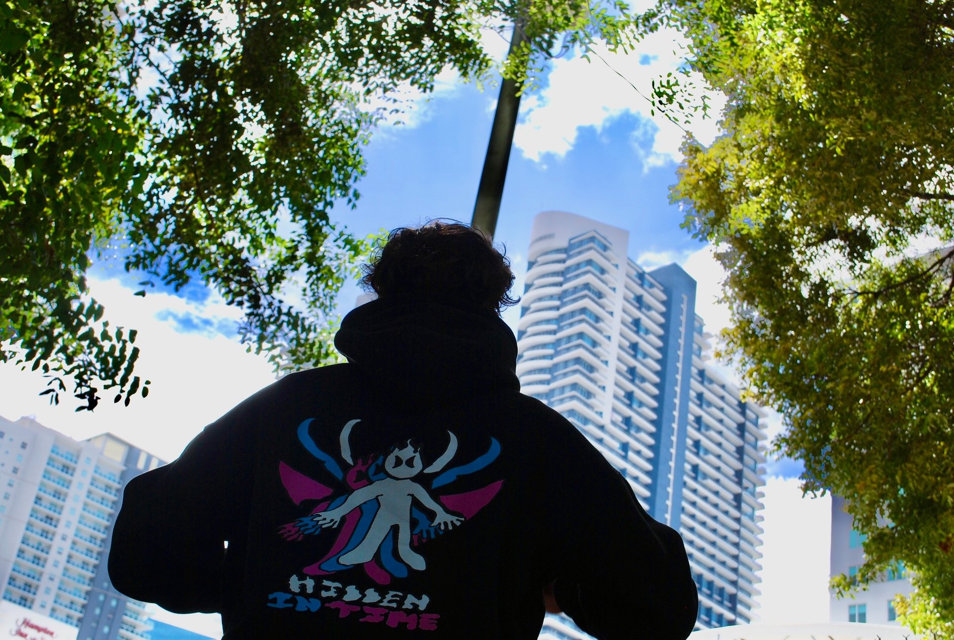 woman wearing yellow long-sleeved dress under white clouds and blue sky during daytime
