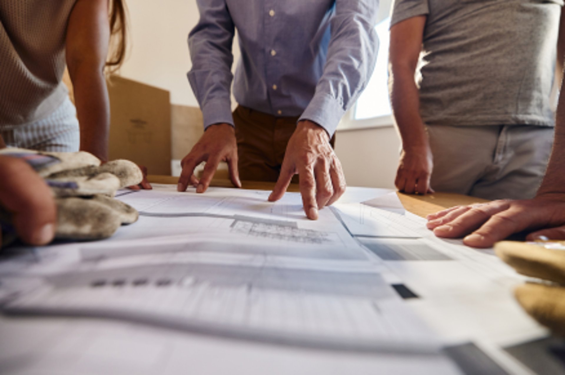 an abstract photo of a curved building with a blue sky in the background