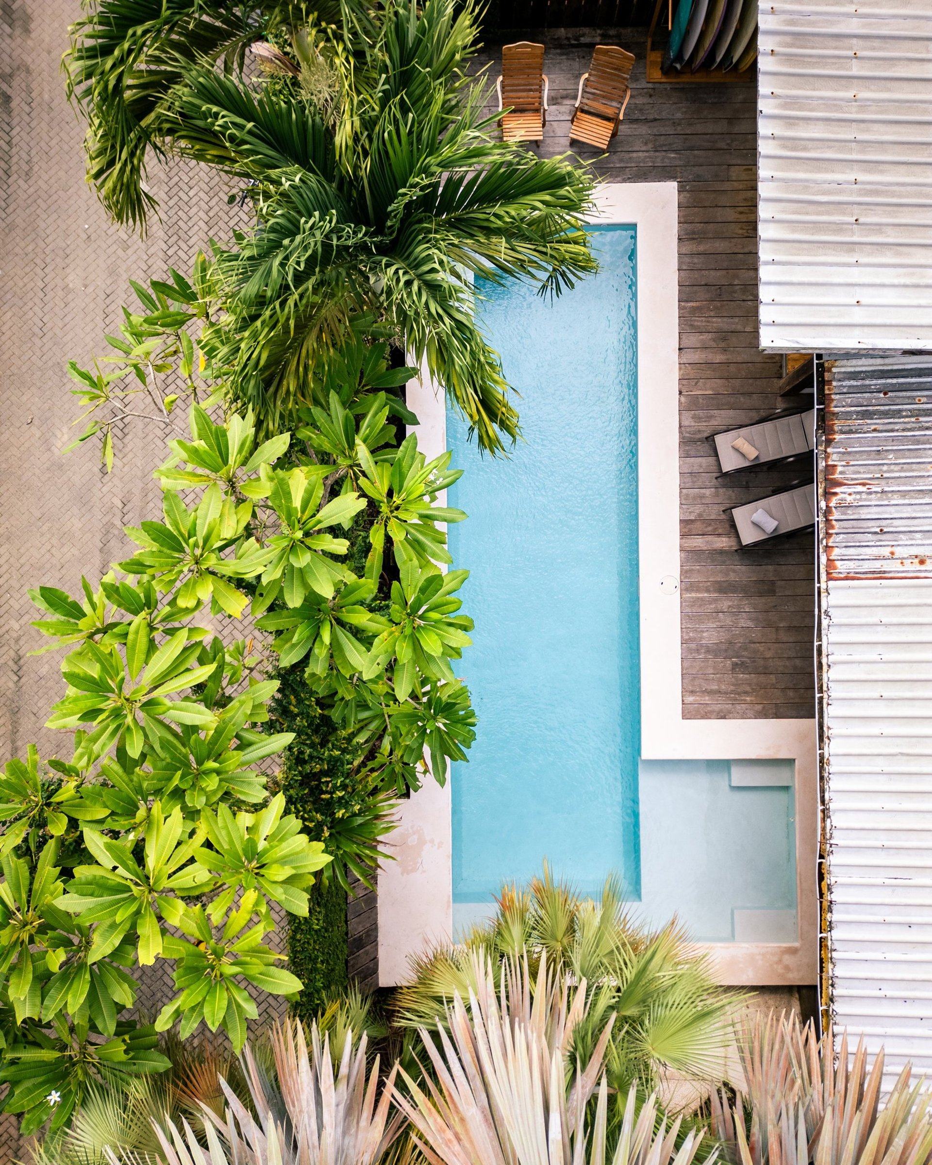 an abstract photo of a curved building with a blue sky in the background
