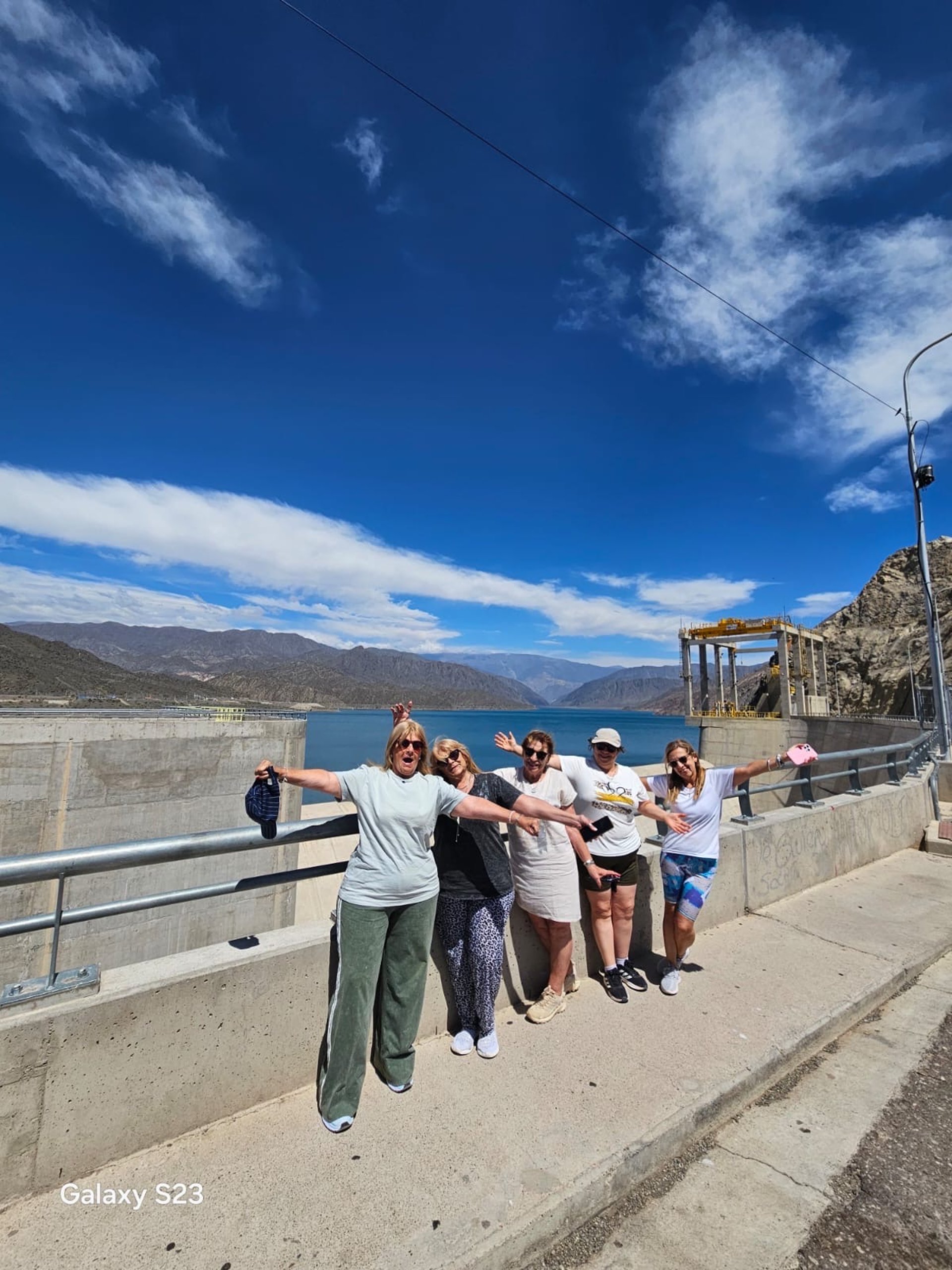 an abstract photo of a curved building with a blue sky in the background