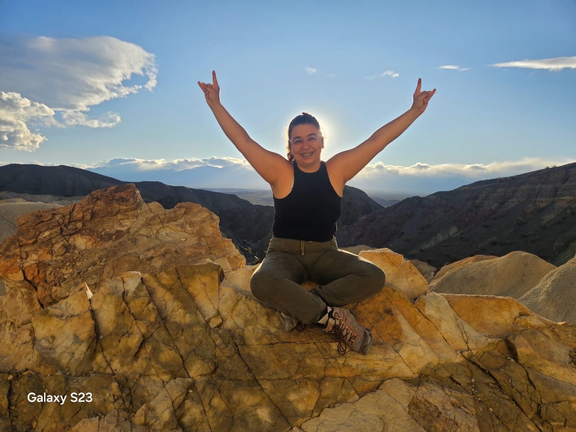 an abstract photo of a curved building with a blue sky in the background