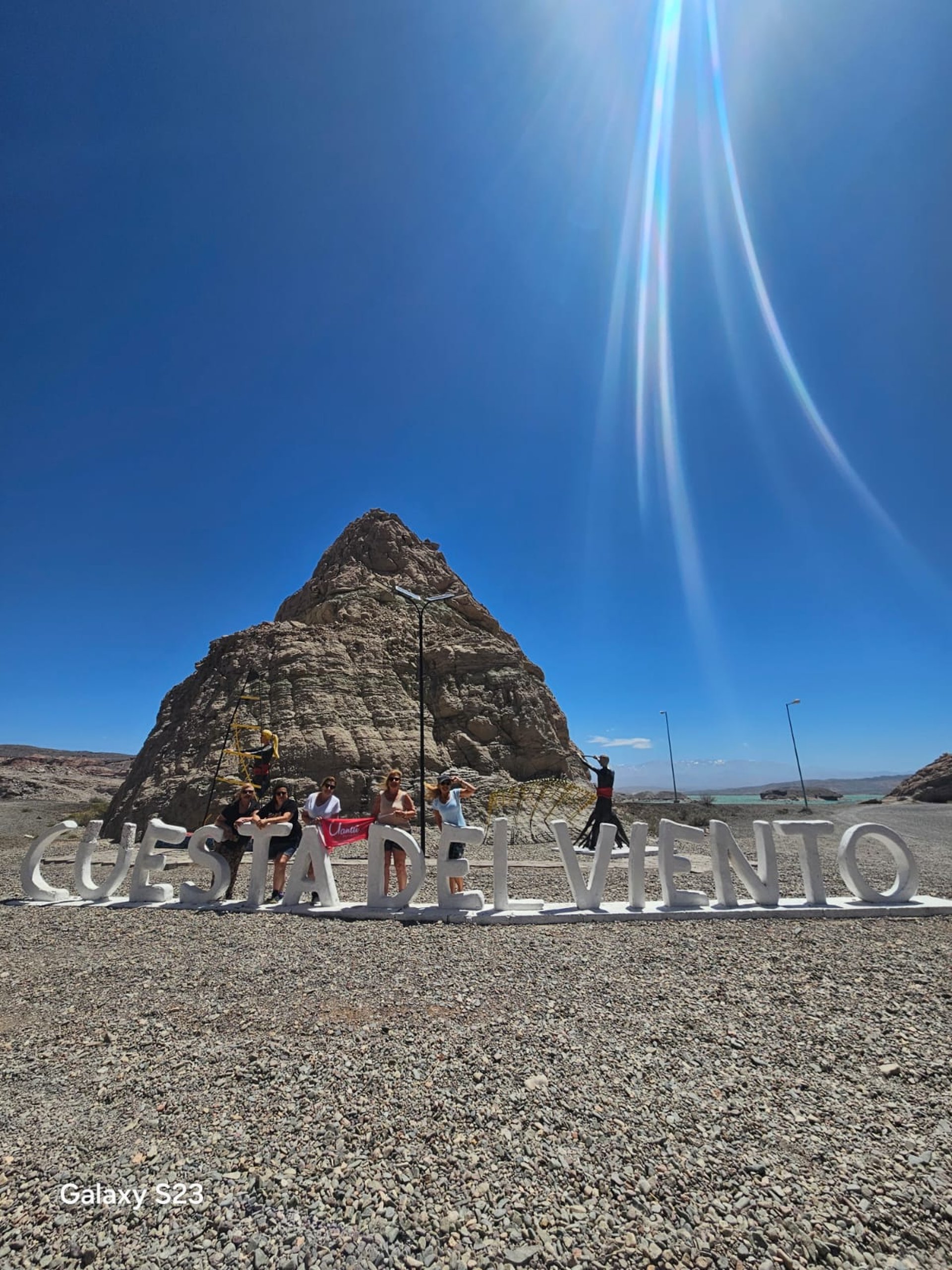 an abstract photo of a curved building with a blue sky in the background
