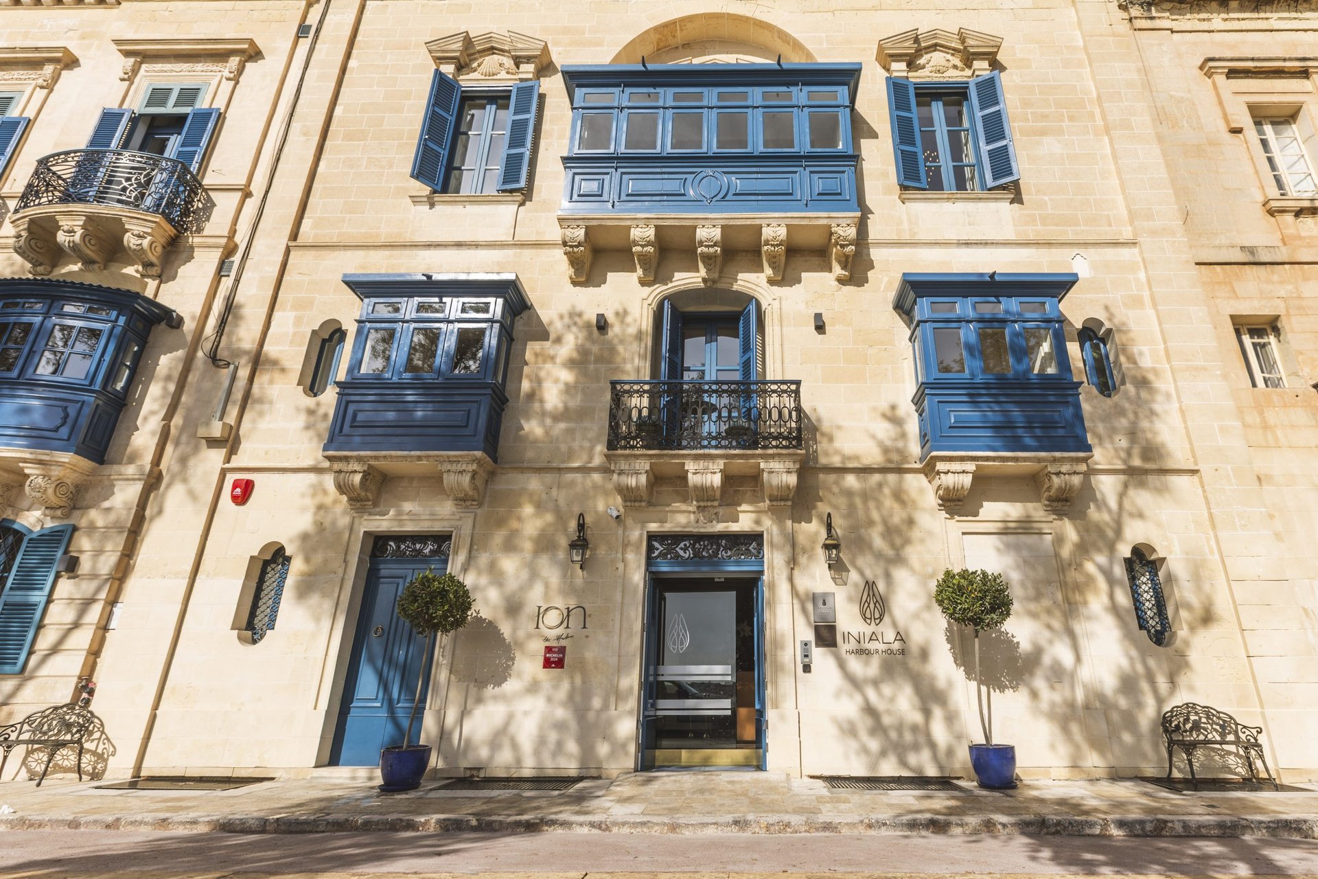 a table with a candle on it in front of a city at night