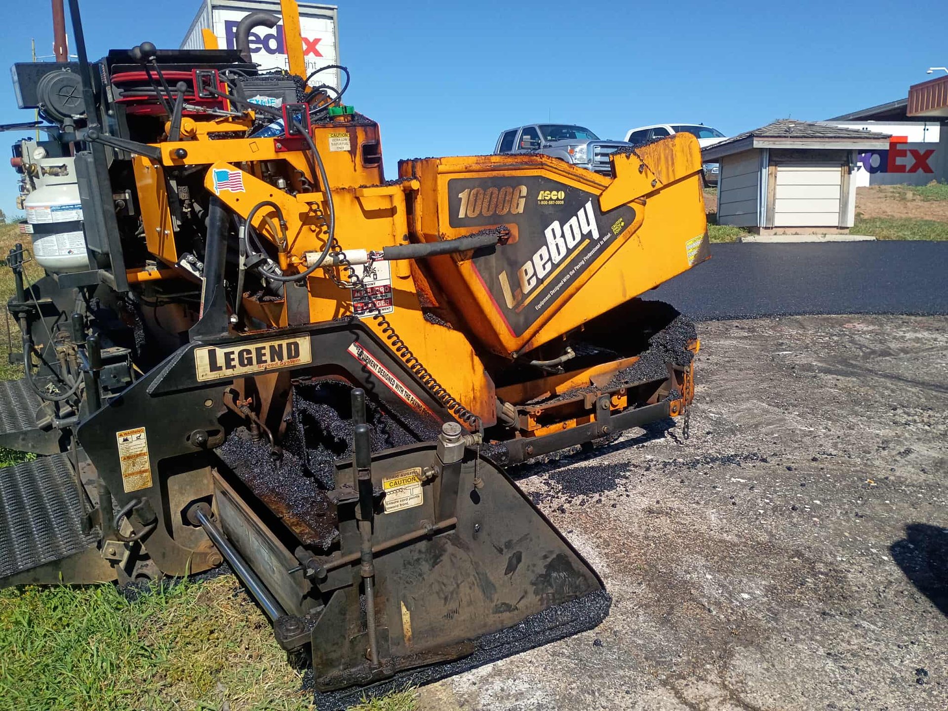 an abstract photo of a curved building with a blue sky in the background
