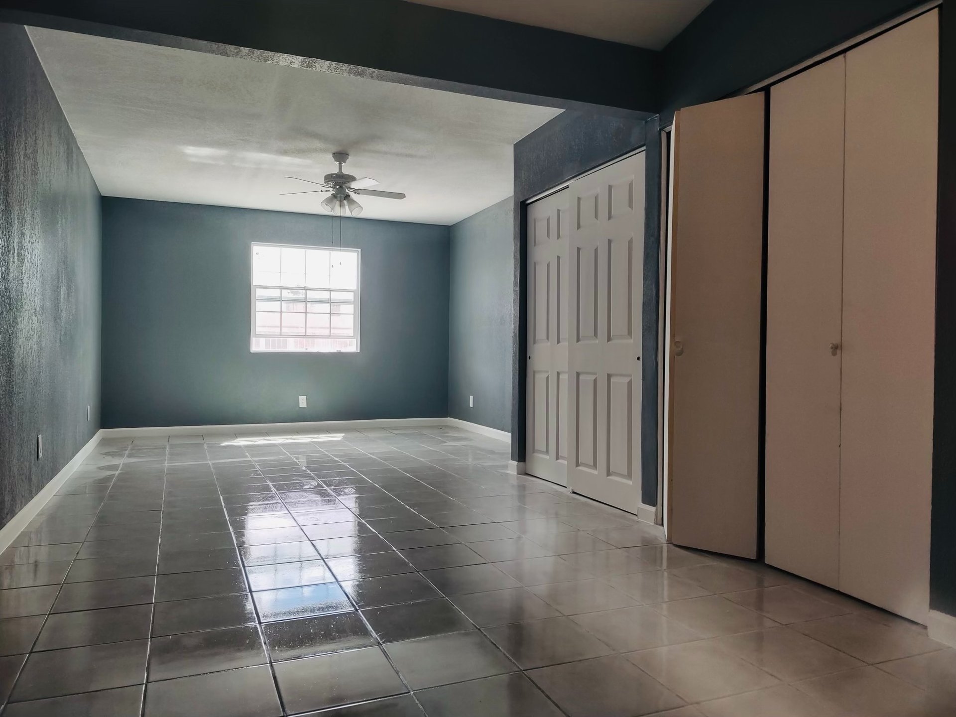 an abstract photo of a curved building with a blue sky in the background