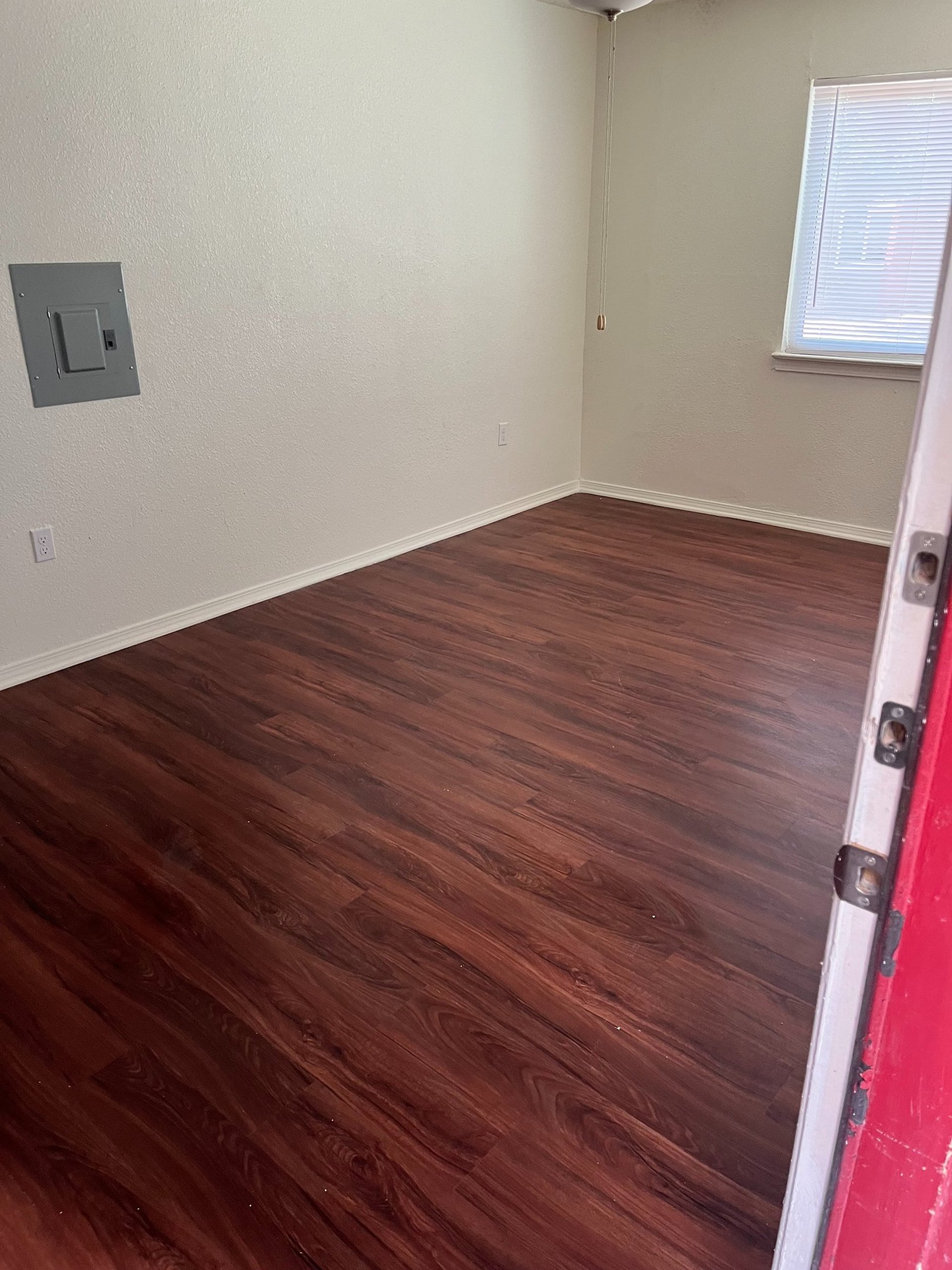 an abstract photo of a curved building with a blue sky in the background