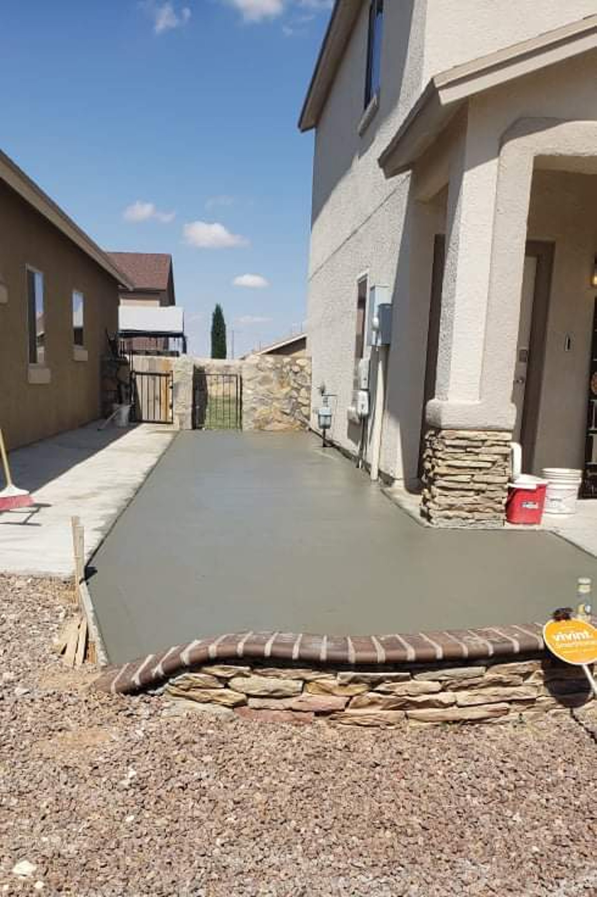 an abstract photo of a curved building with a blue sky in the background