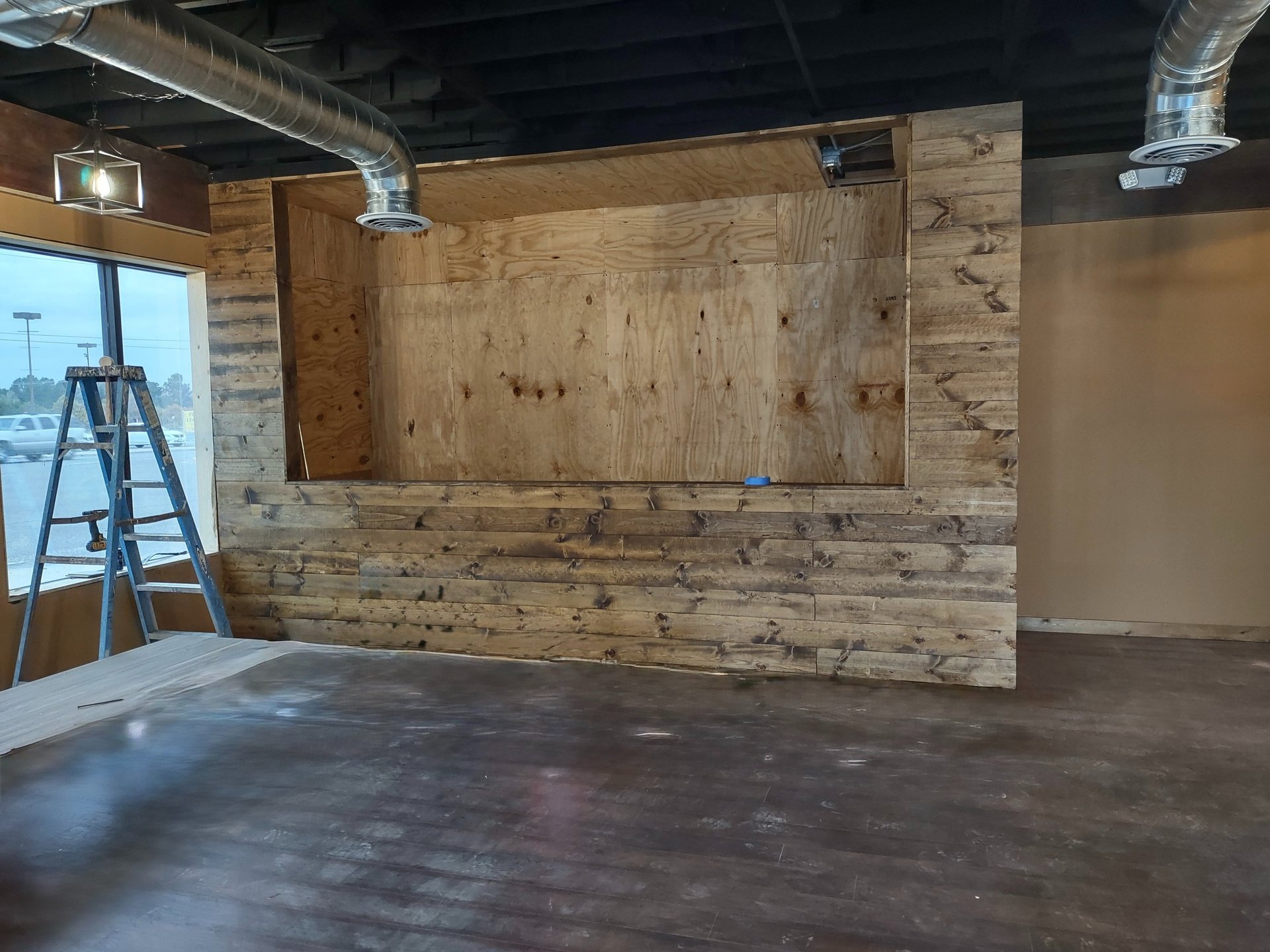 an abstract photo of a curved building with a blue sky in the background