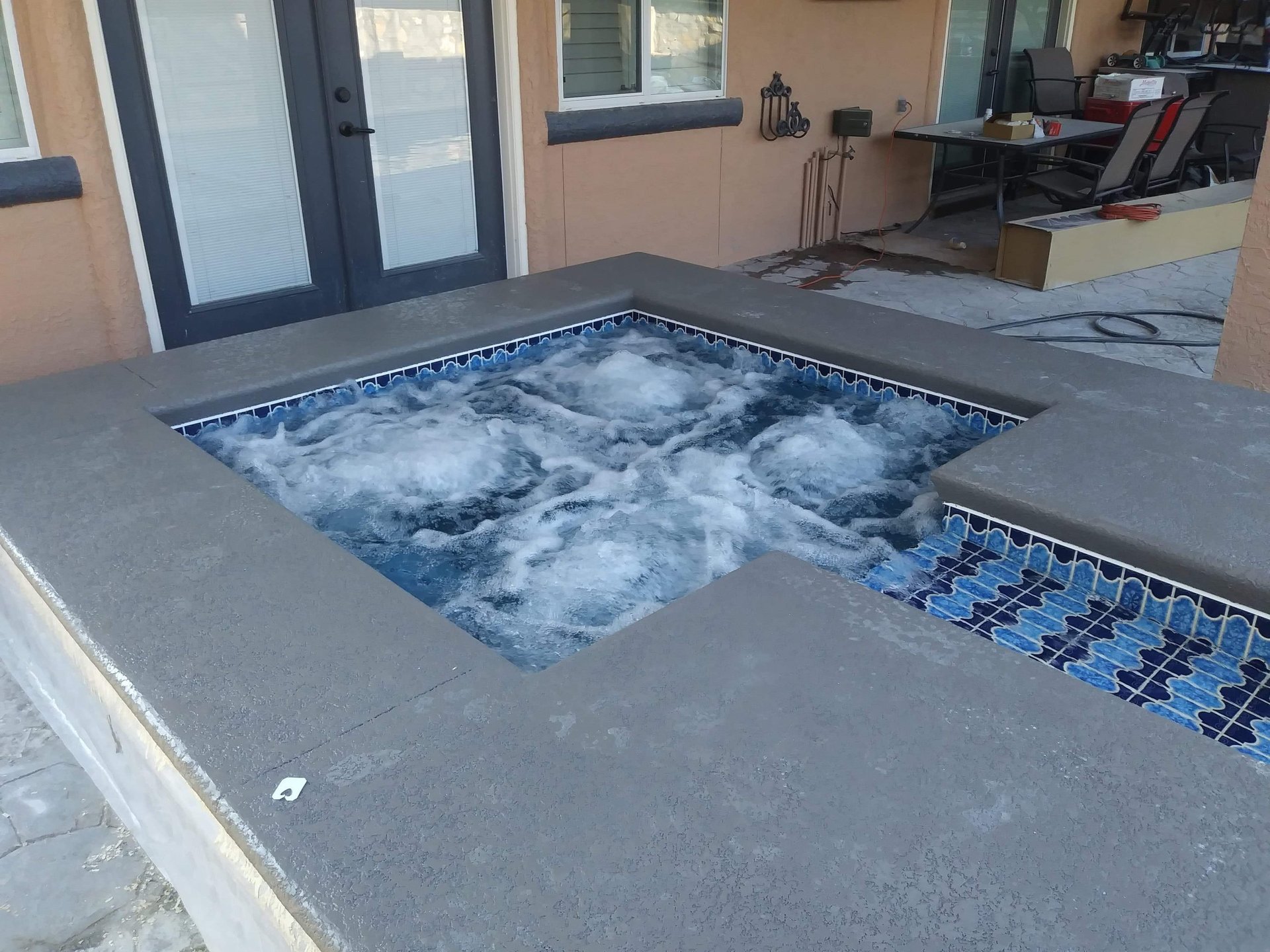 an abstract photo of a curved building with a blue sky in the background