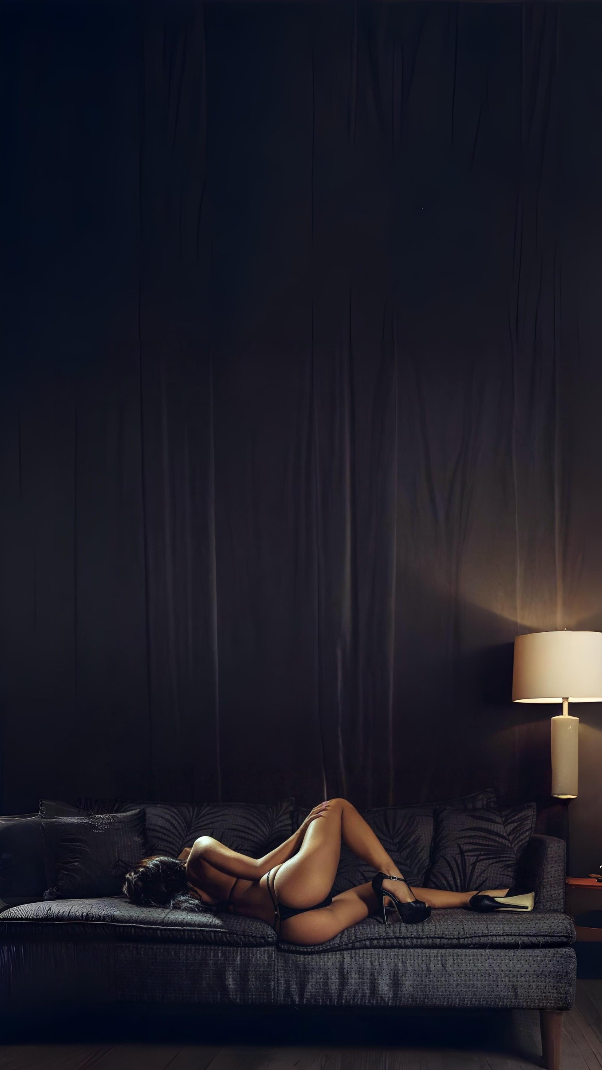 A person lying on their side under a sheet.