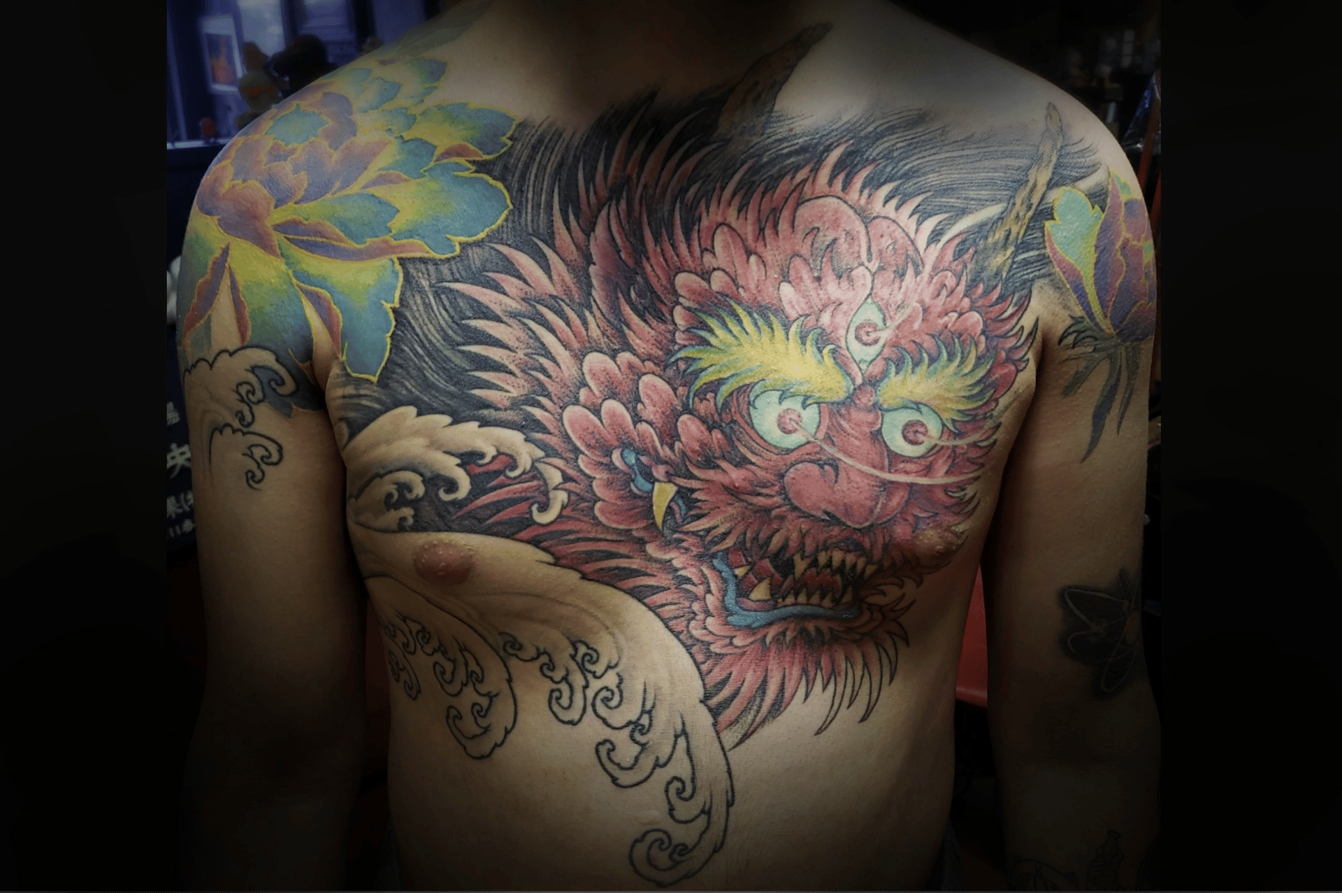 Japanese oni red demon chest tattoo by Symbolic Tattoo Co Pasco WA