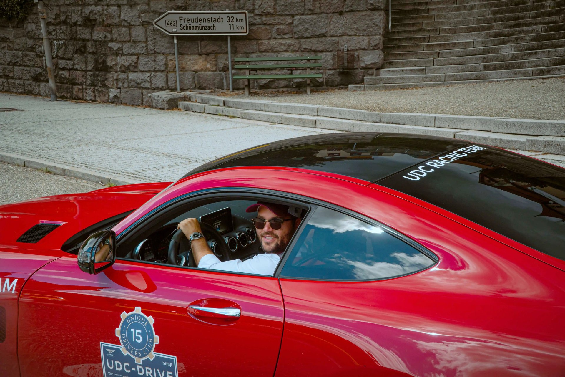 an abstract photo of a curved building with a blue sky in the background