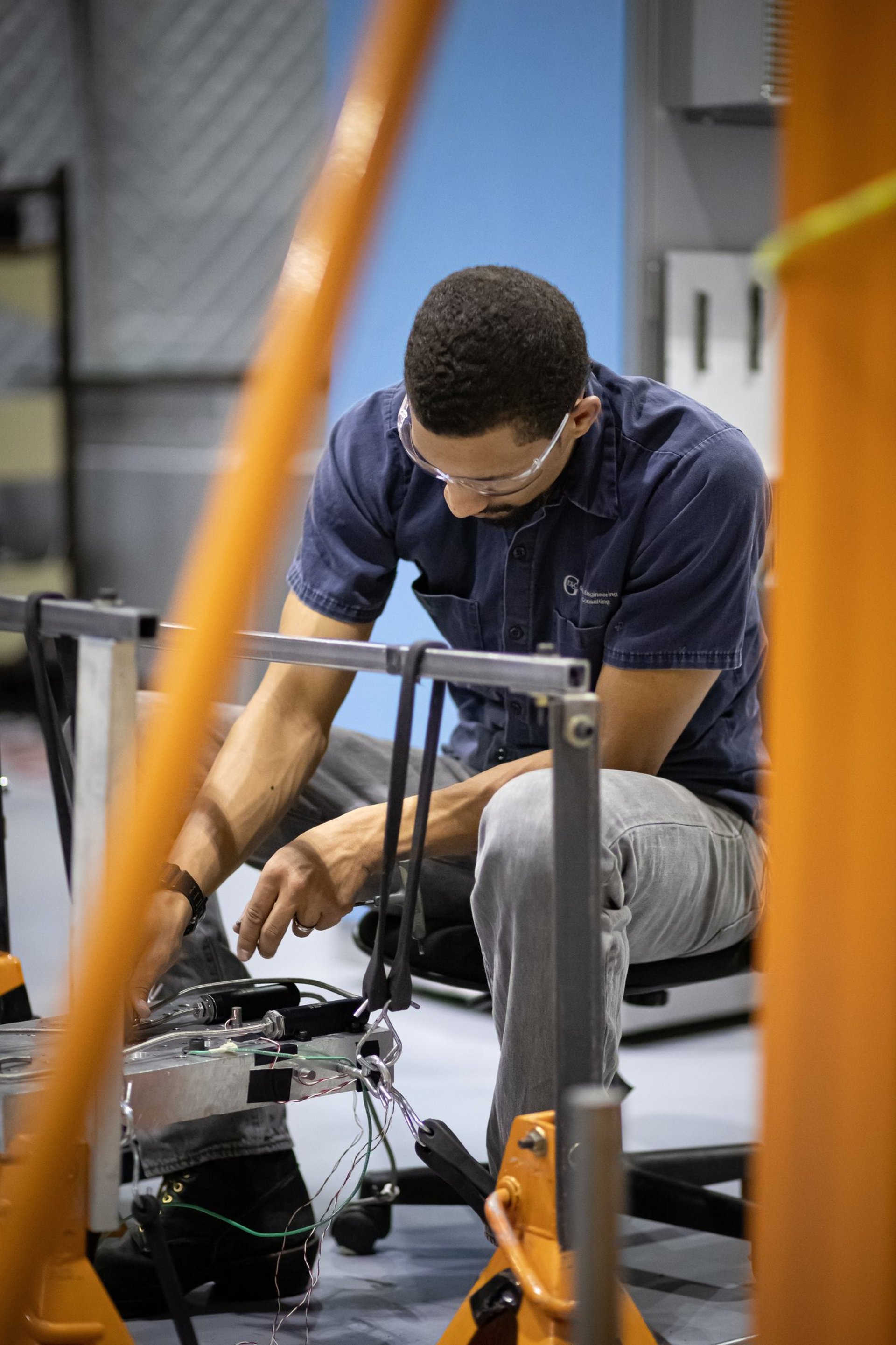 Commercial branding photograph of a technician working on equipment in Tempe, Arizona.