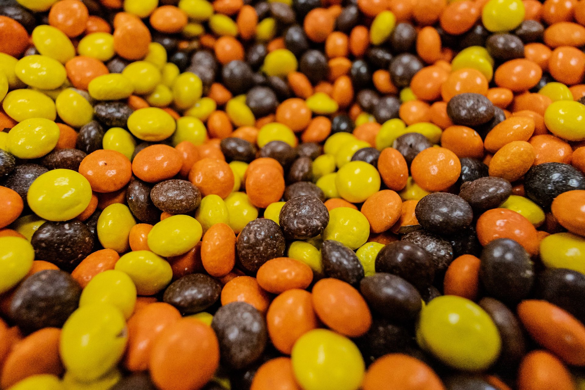 Close-up product photography of colorful chocolate candies.