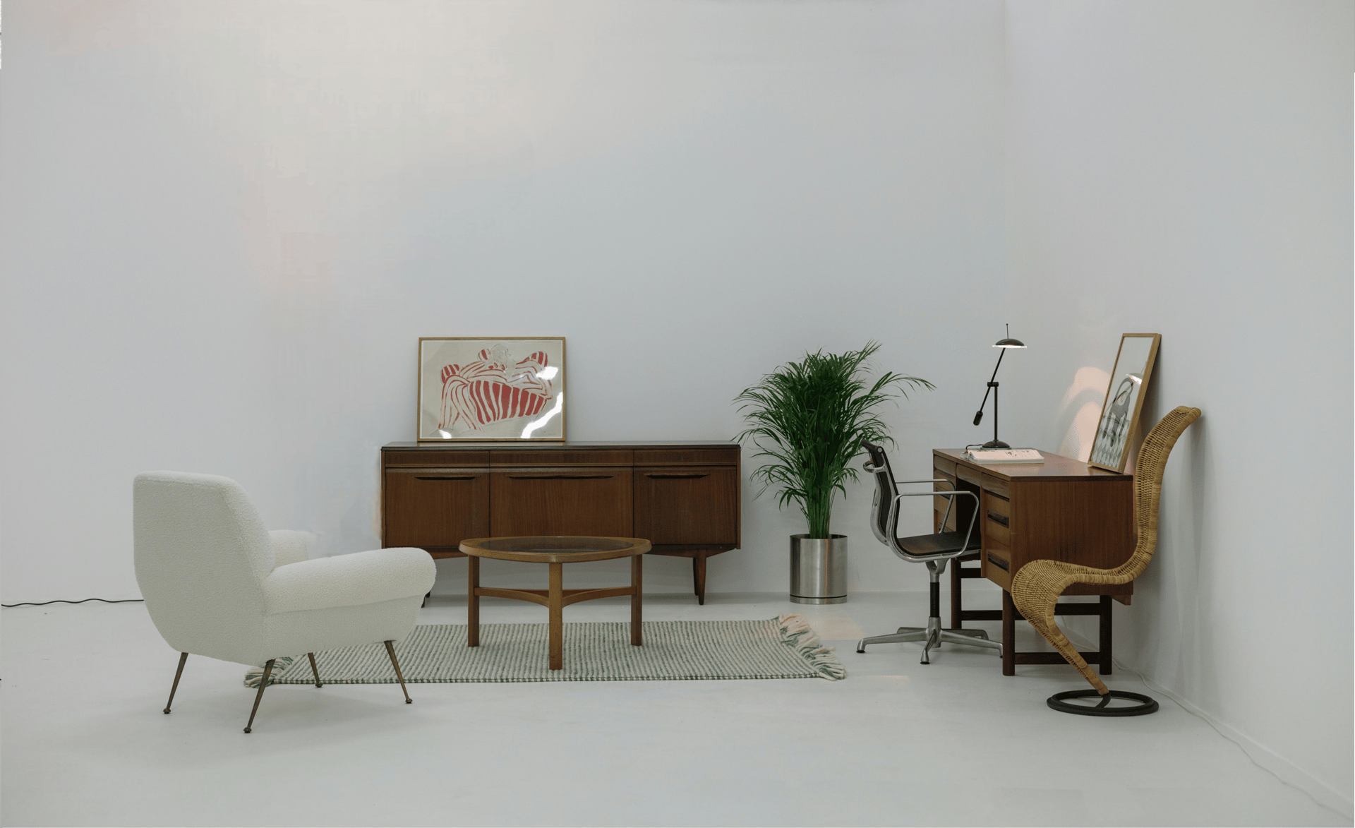 Room full of Mid-Century Modern furniture, combining contemporary and vintage style in a stylish living space.