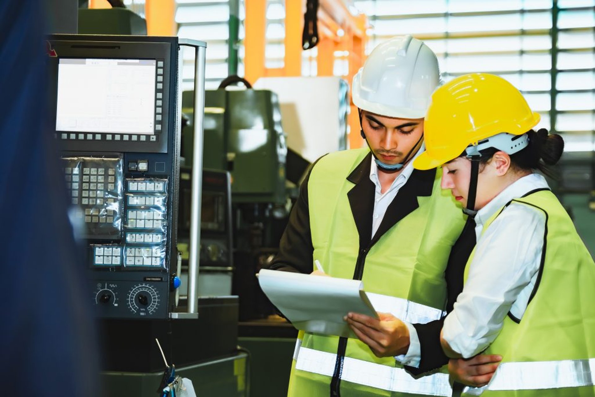 group of people wearing orange and yellow safety vest