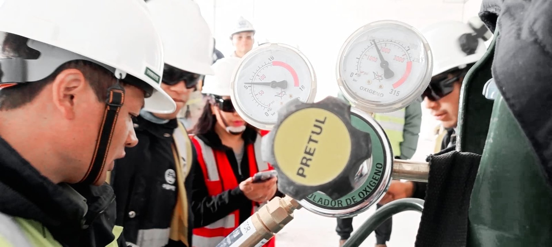 group of people wearing orange and yellow safety vest