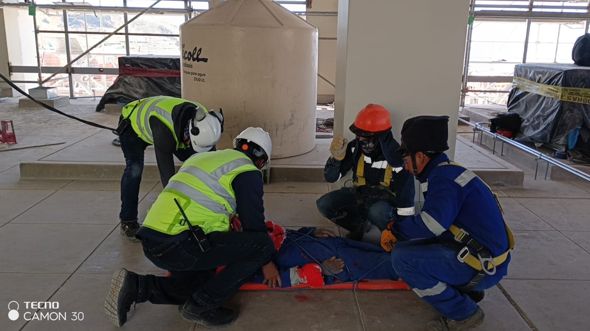 group of people wearing orange and yellow safety vest