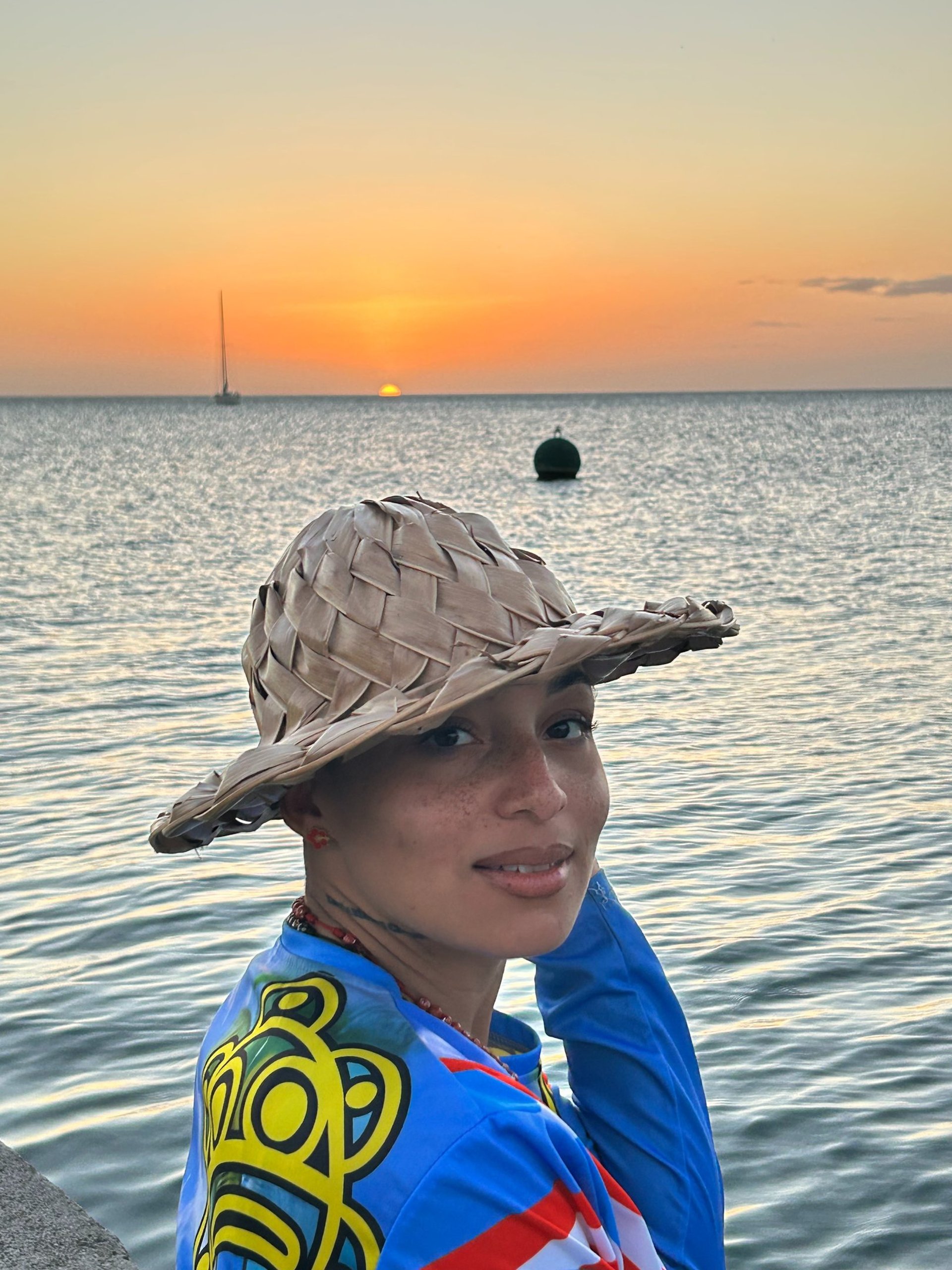 woman wearing yellow long-sleeved dress under white clouds and blue sky during daytime