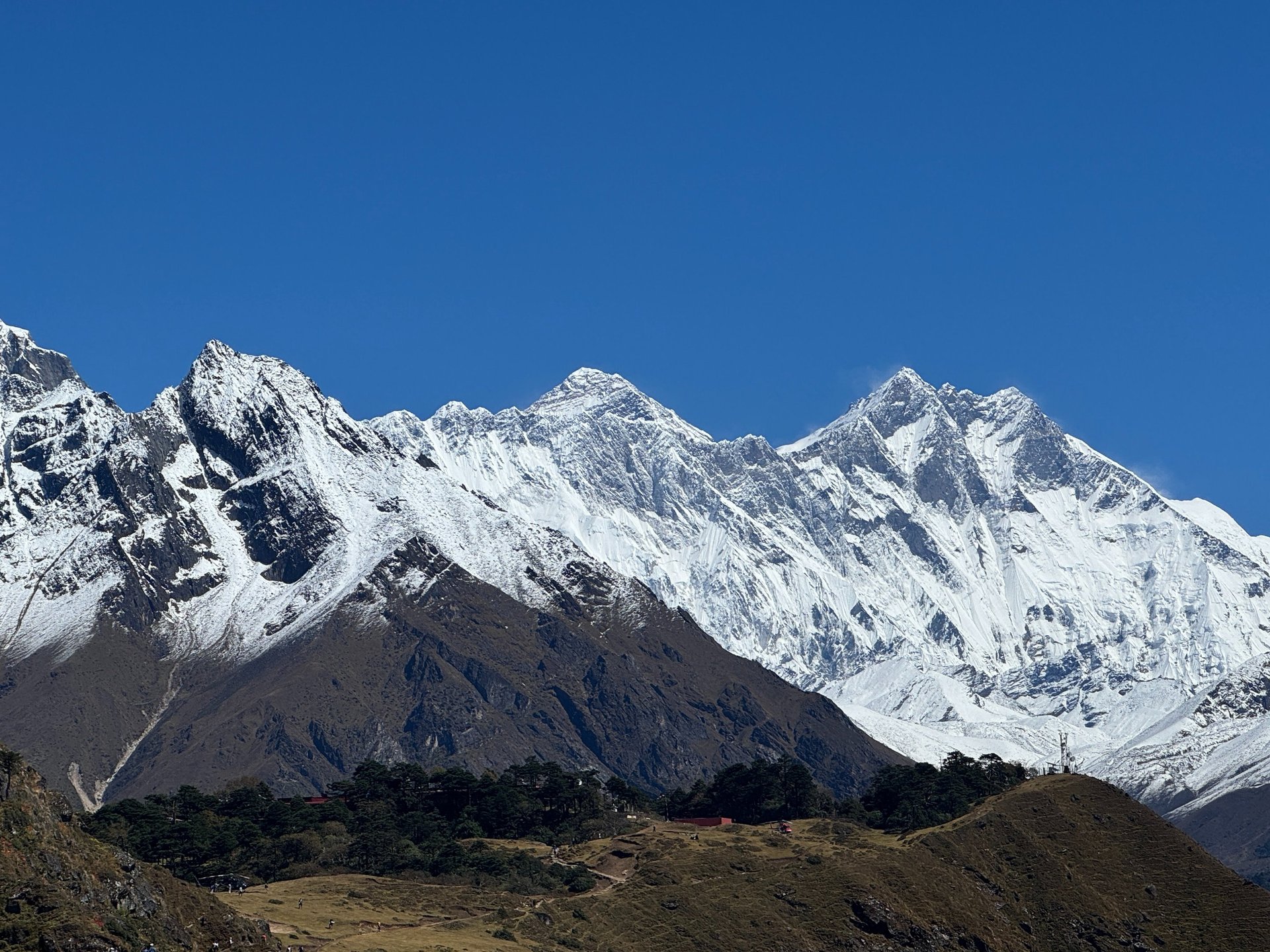 woman wearing yellow long-sleeved dress under white clouds and blue sky during daytime