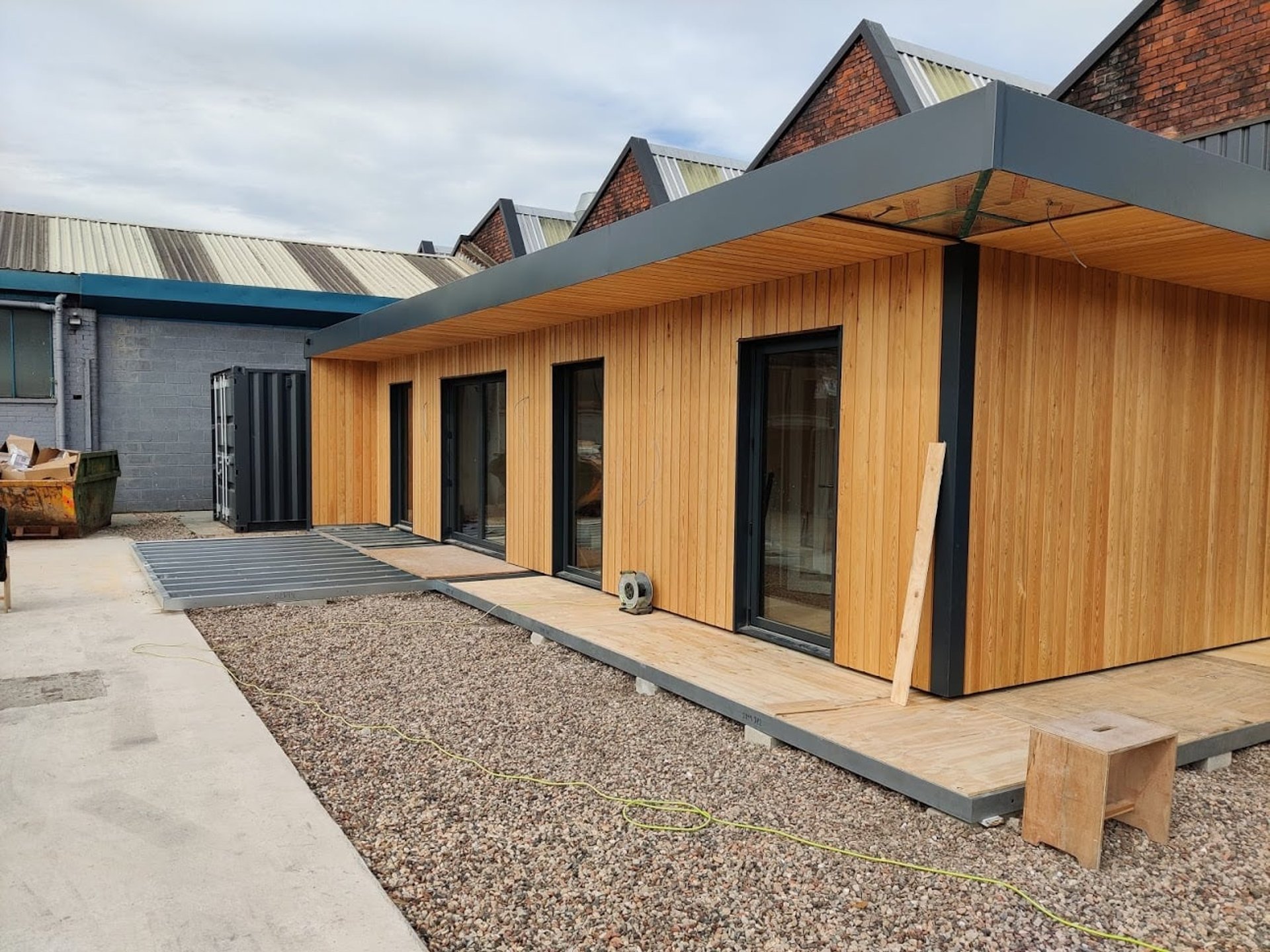black and brown leather padded tub sofa