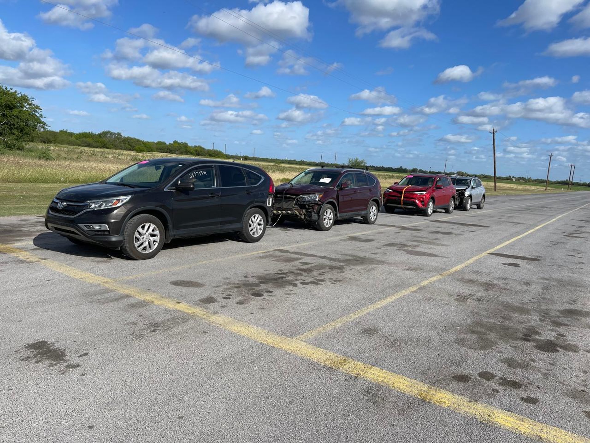A row of cars parked on the side of the road