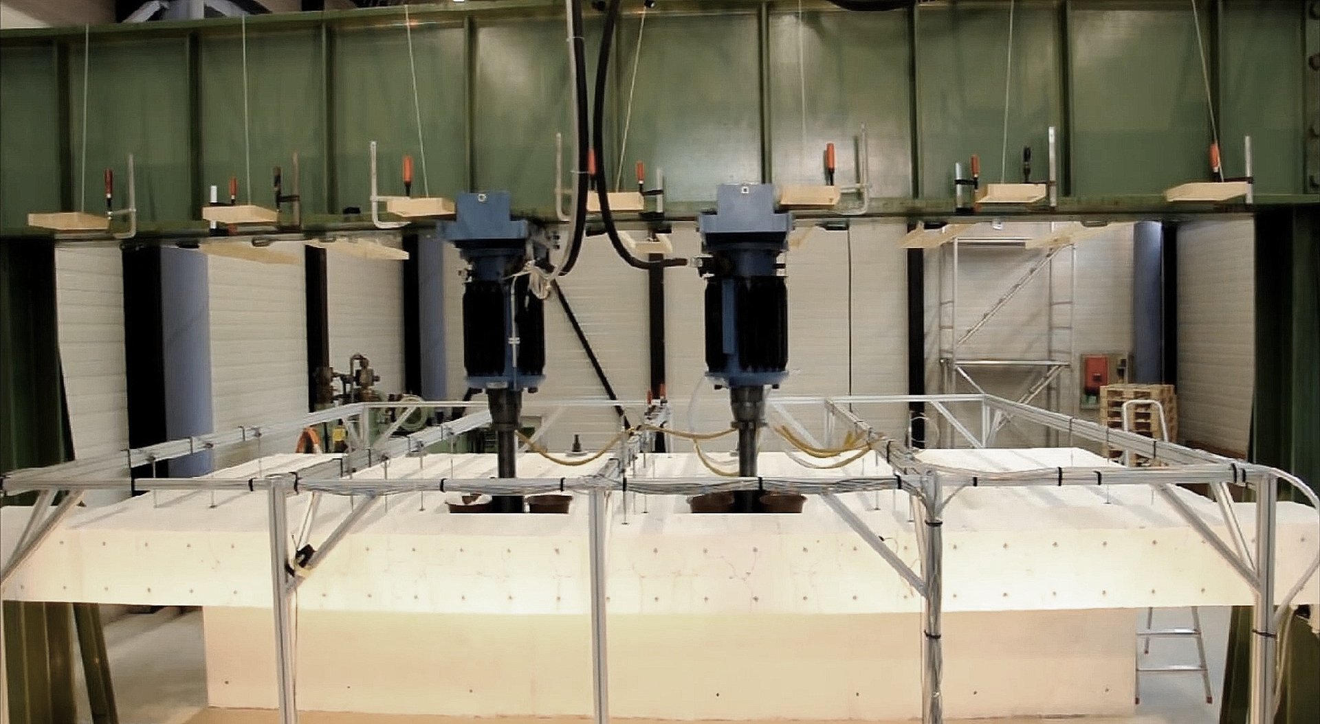 an abstract photo of a curved building with a blue sky in the background