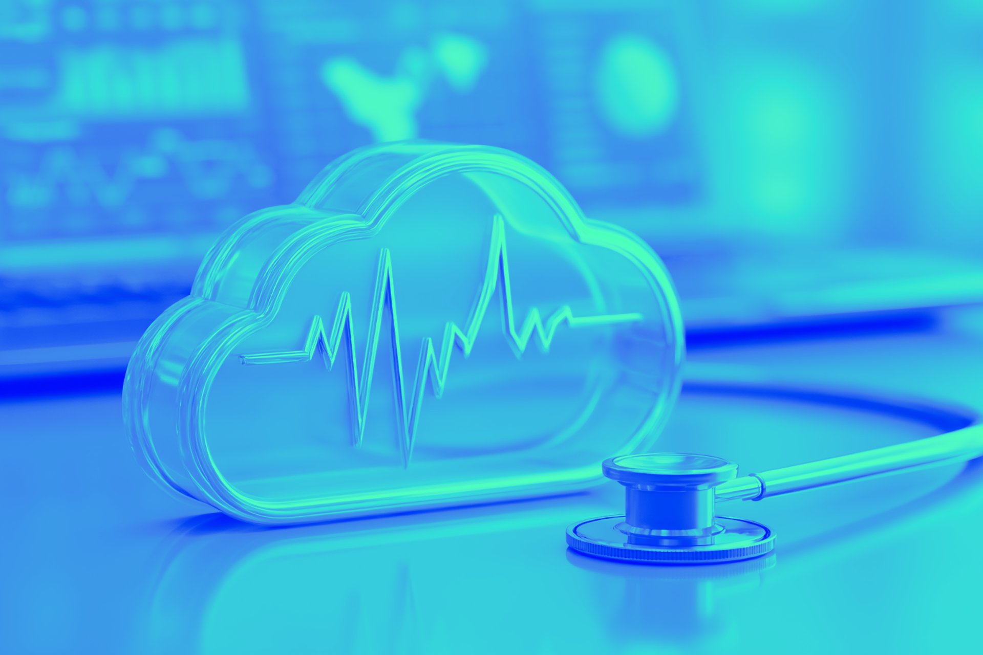 person sitting while using laptop computer and green stethoscope near