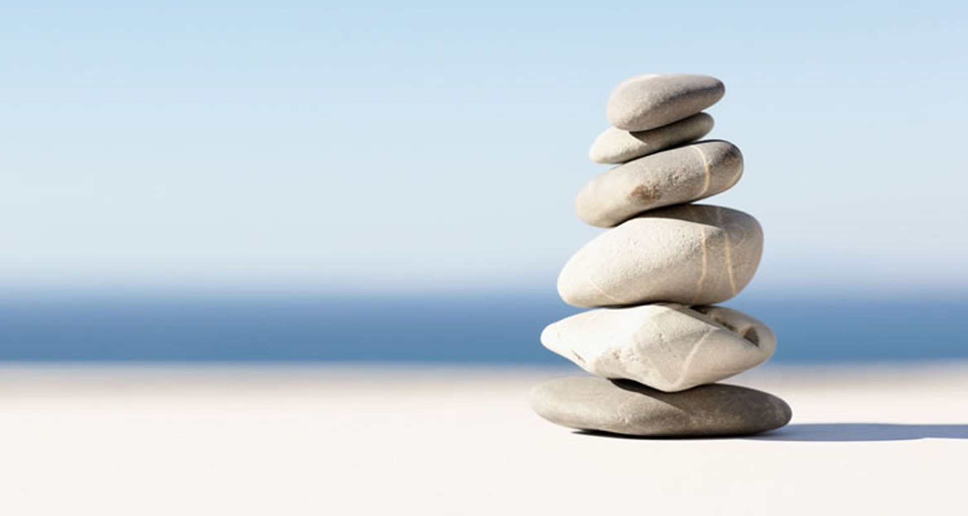 a wooden table topped with bottles of essential oils