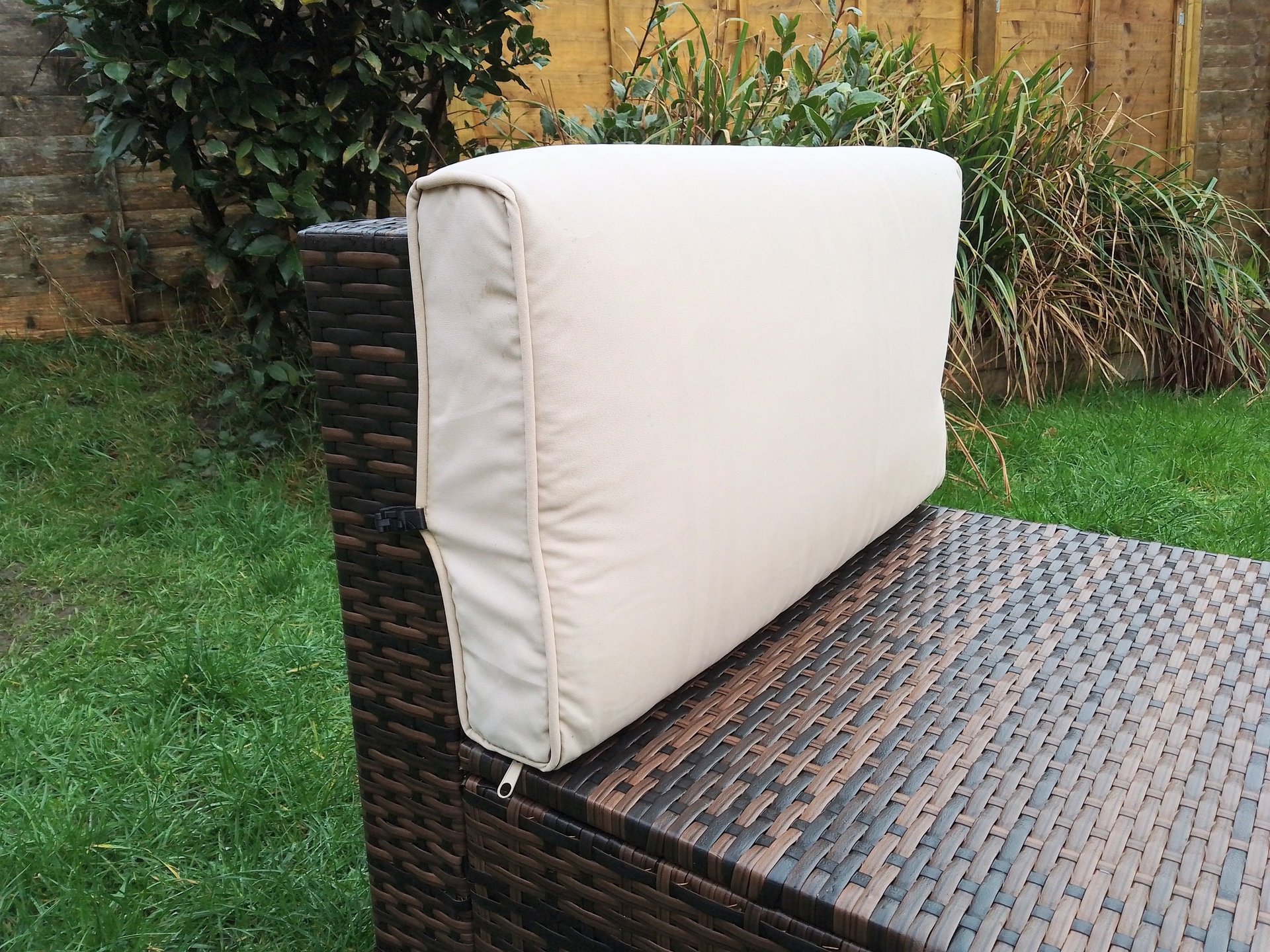 Rattan cushion clip in use on rattan furniture