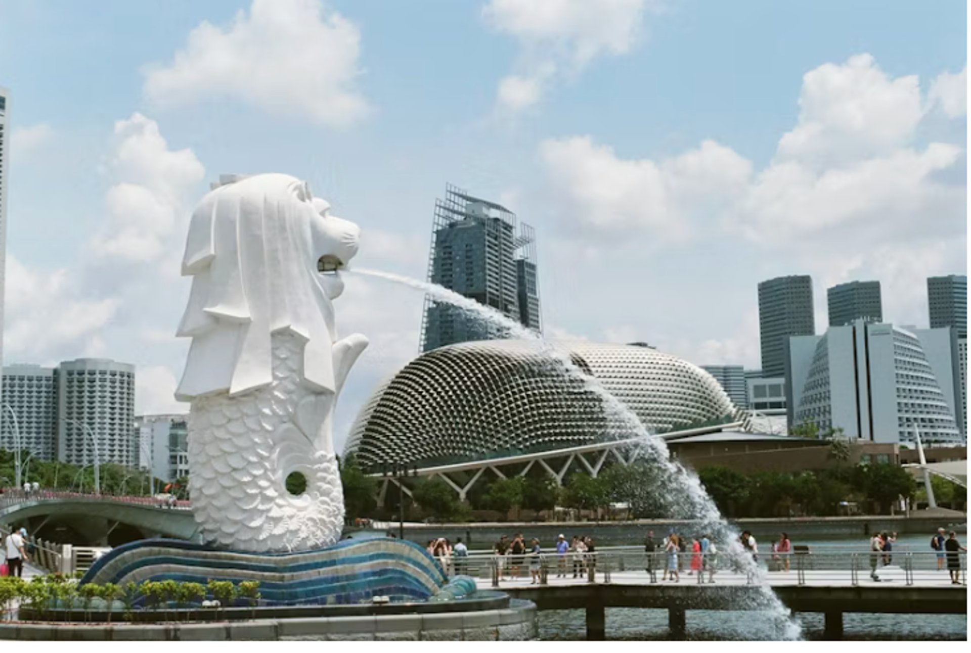 an abstract photo of a curved building with a blue sky in the background