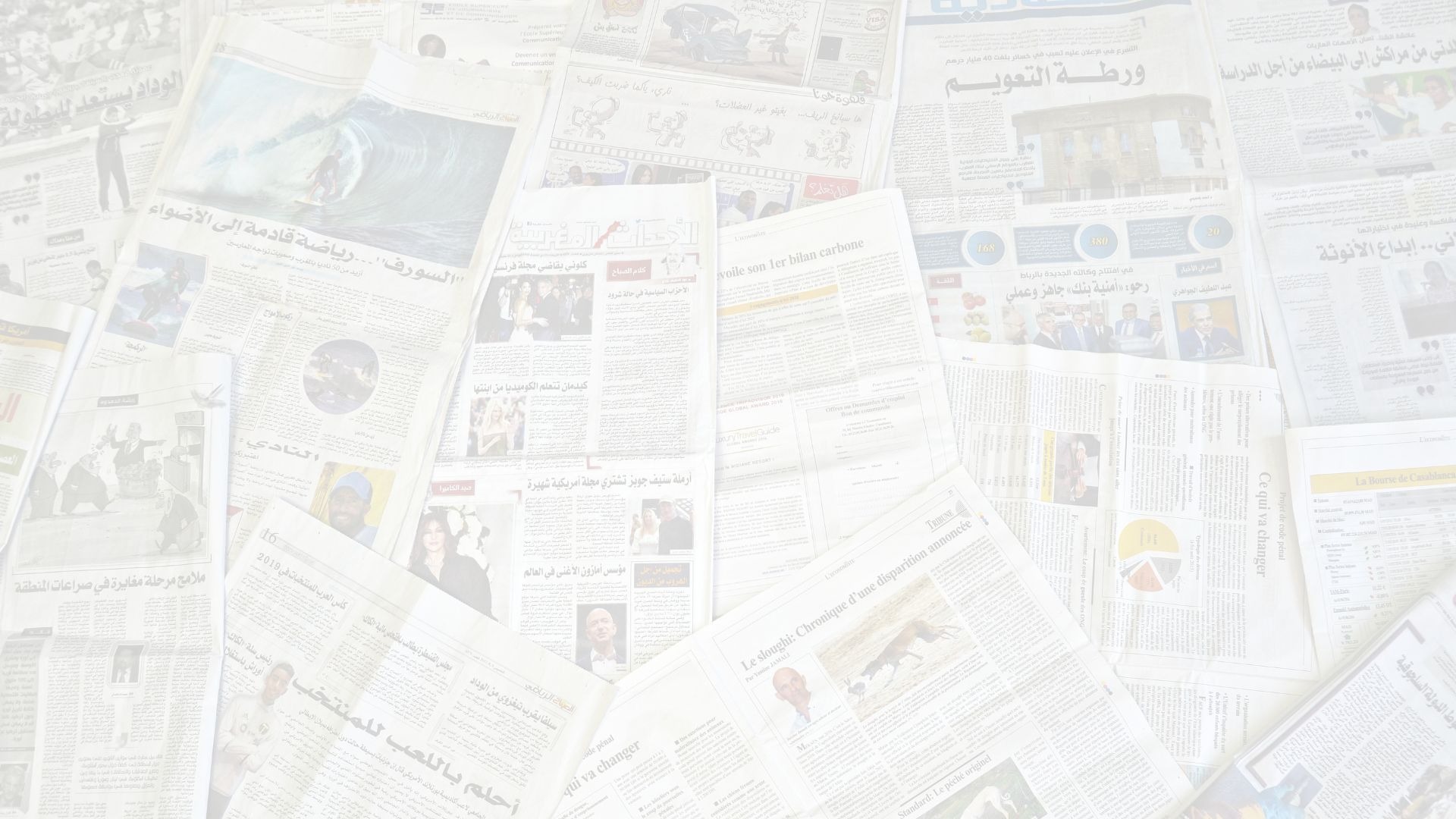 man sitting on bench reading newspaper