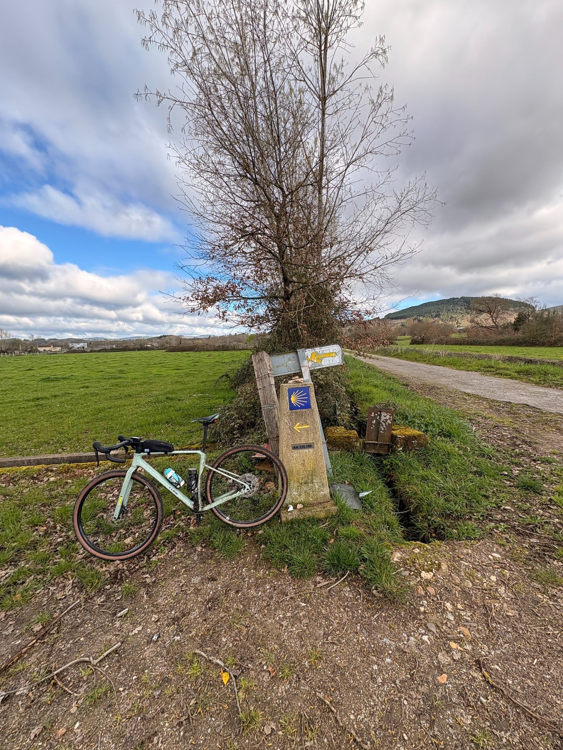 woman wearing yellow long-sleeved dress under white clouds and blue sky during daytime