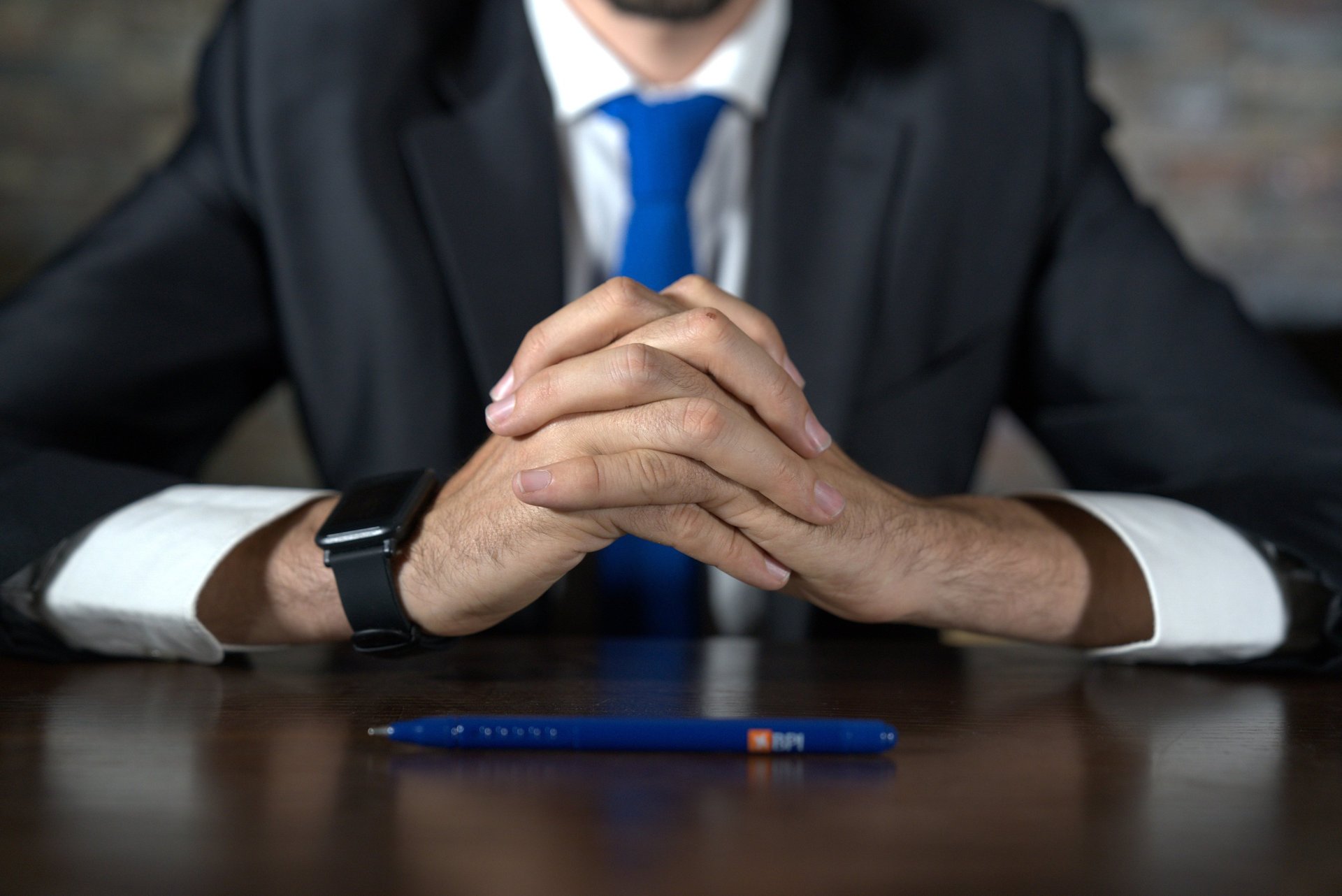 macbook pro on white wooden desk