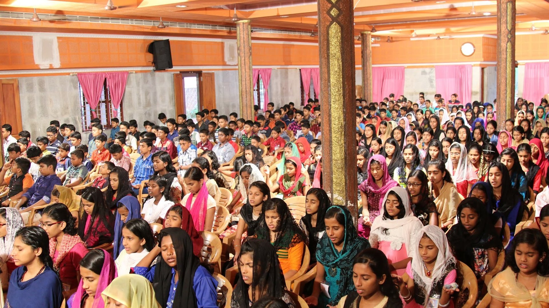 woman wearing yellow long-sleeved dress under white clouds and blue sky during daytime