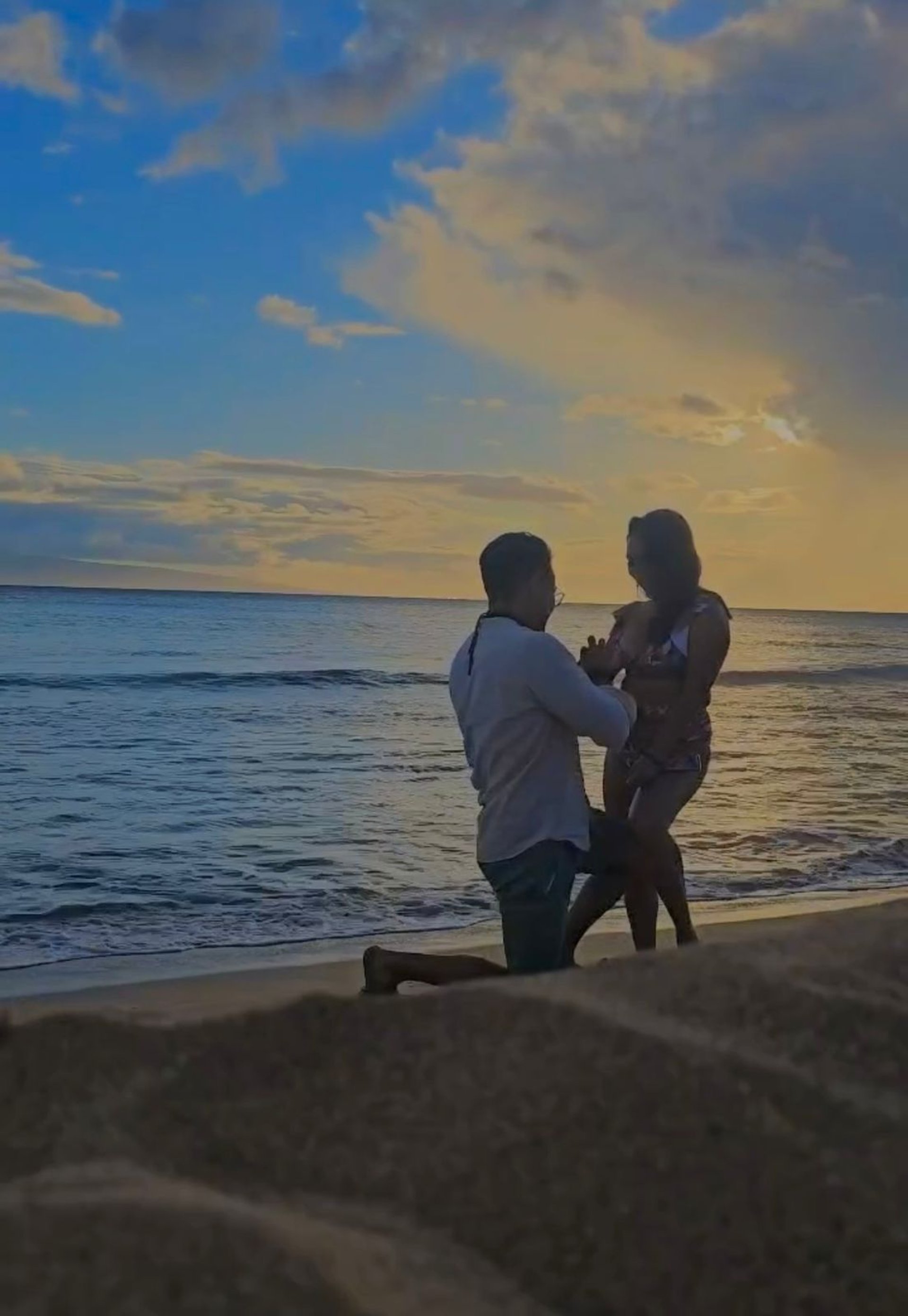 couple wearing silver-colored rings