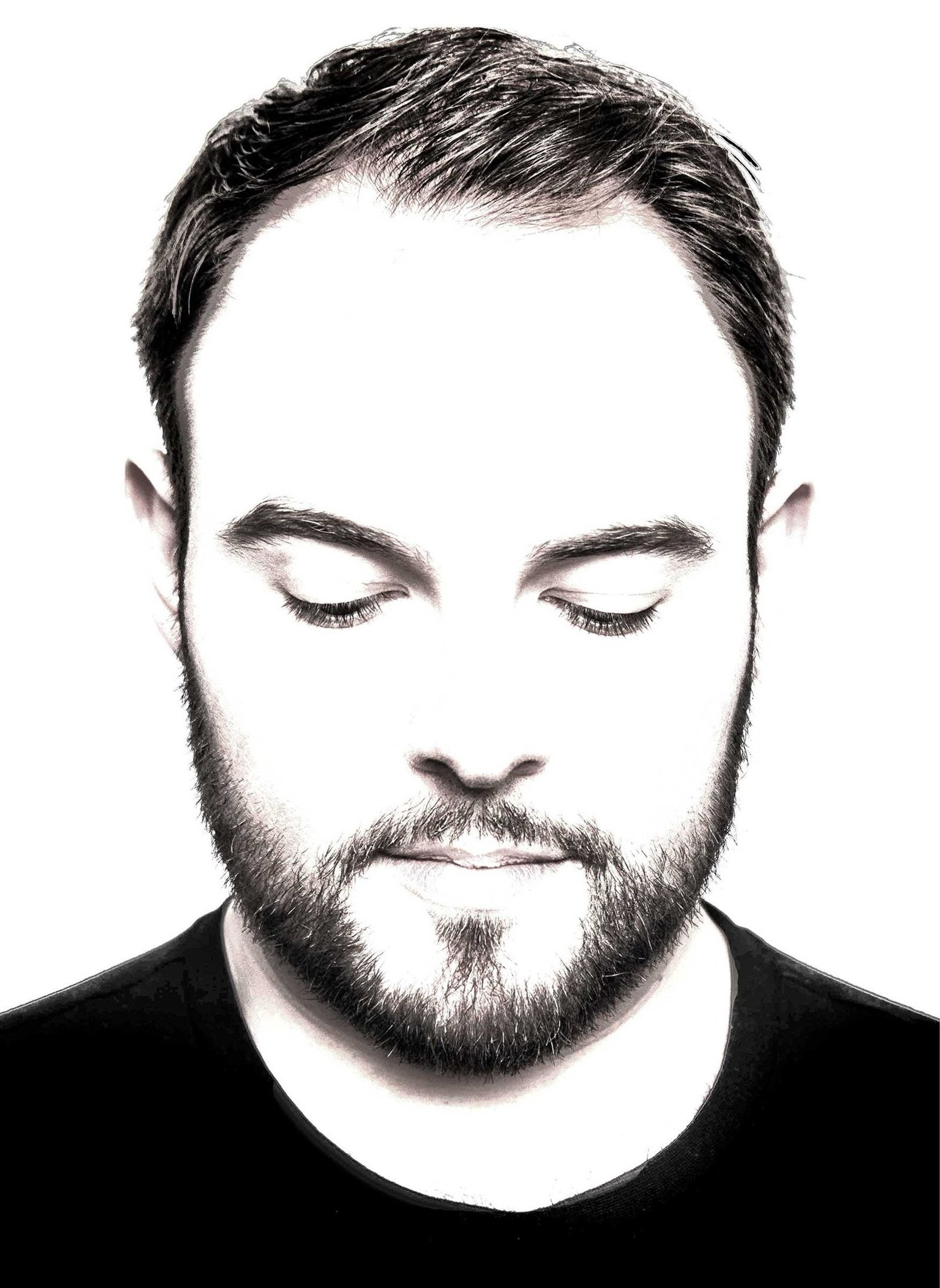 an abstract photo of a curved building with a blue sky in the background