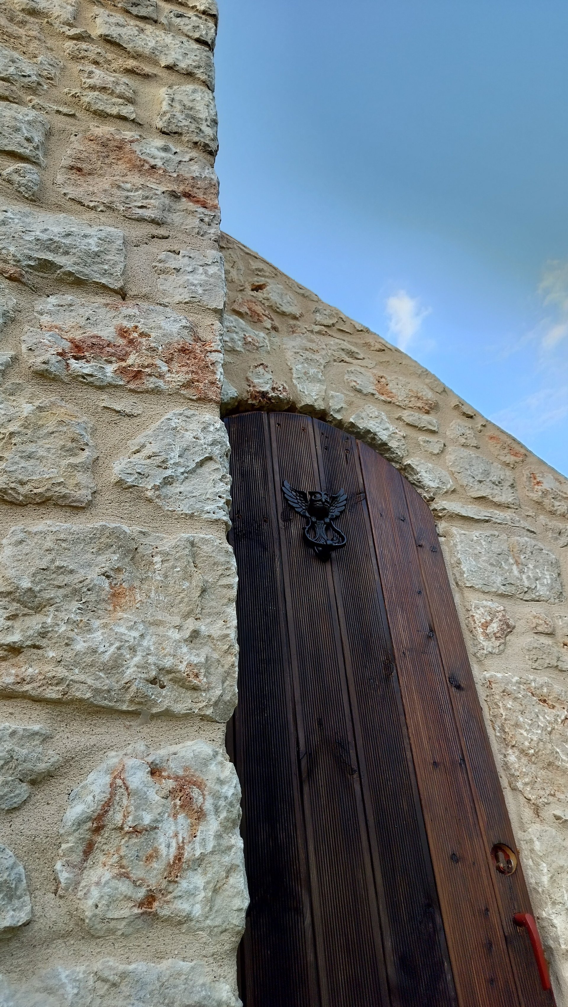 woman wearing yellow long-sleeved dress under white clouds and blue sky during daytime