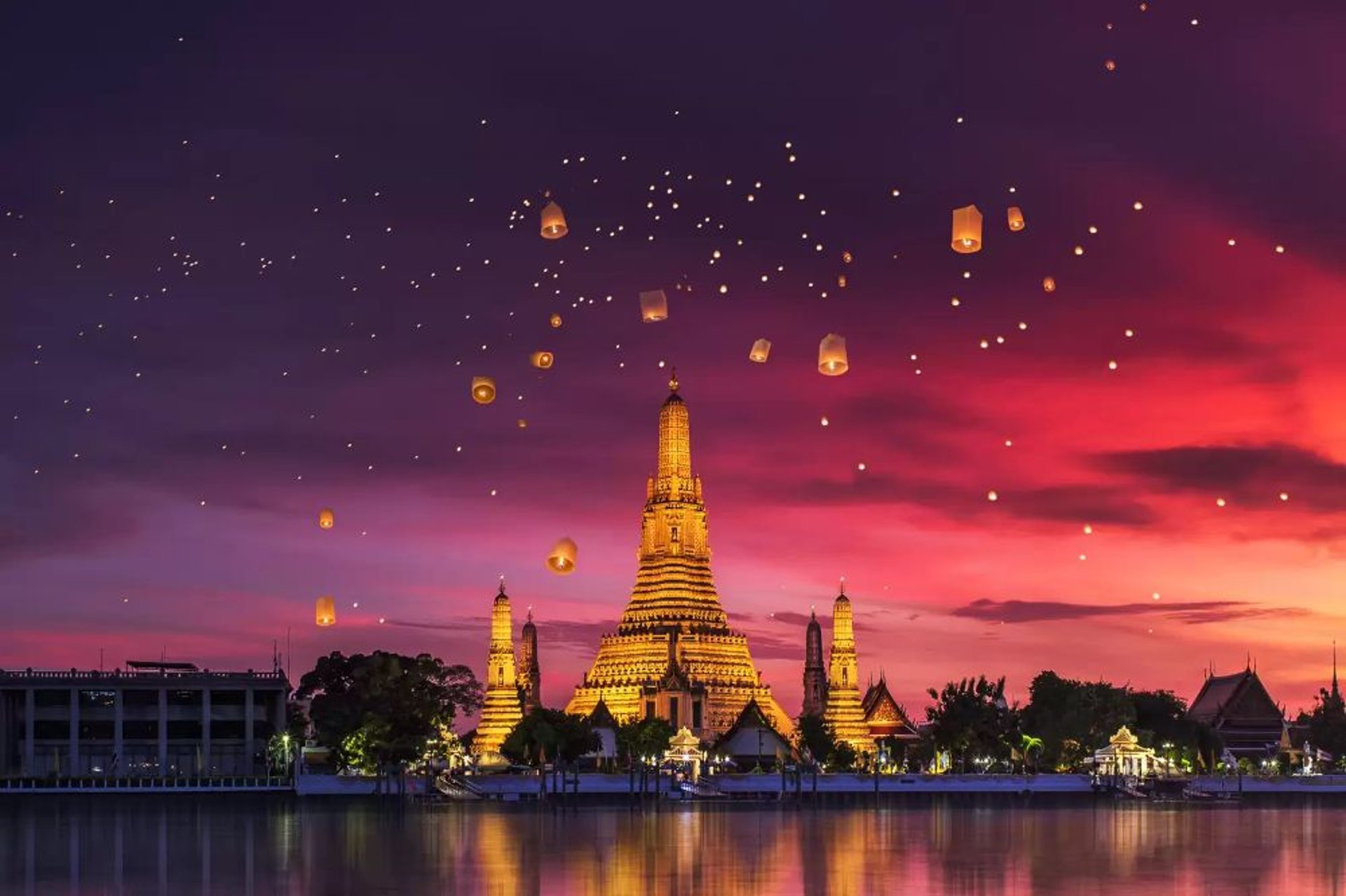 Sunset silhouettes buddhist temples in thailand.