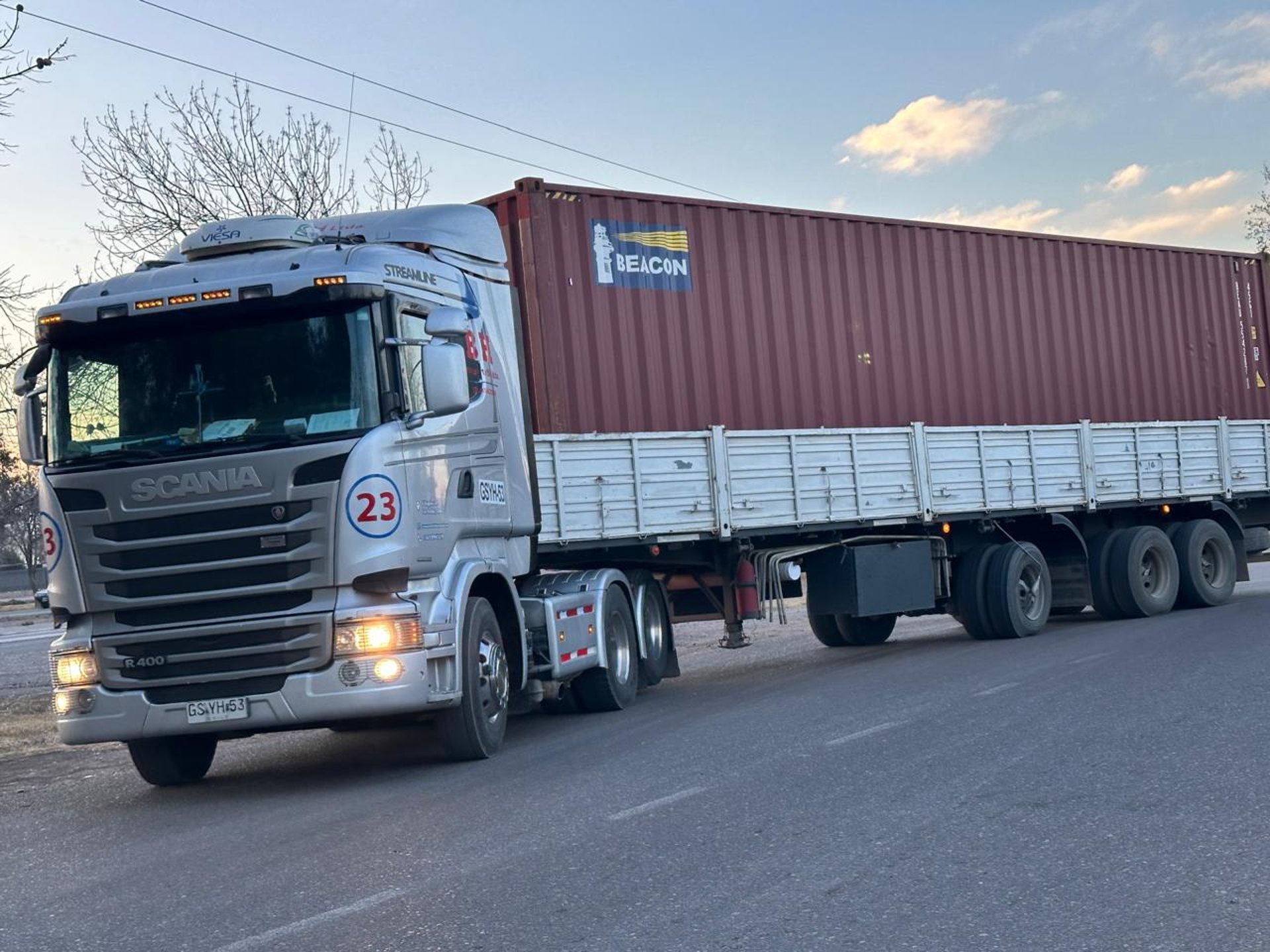 an abstract photo of a curved building with a blue sky in the background
