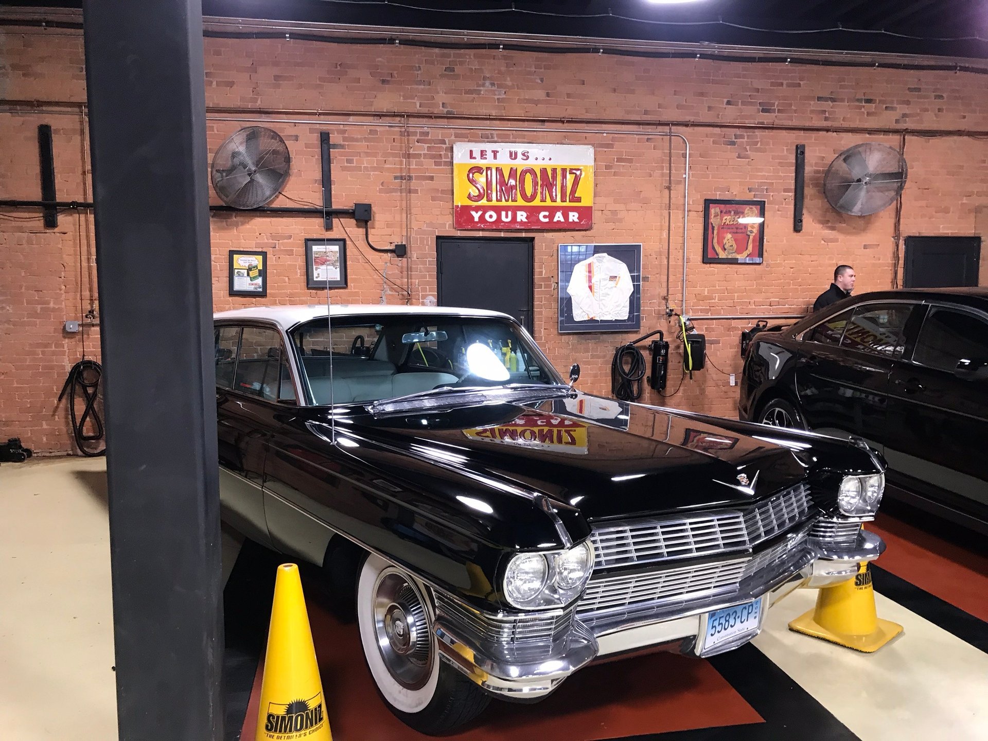 black and brown leather padded tub sofa