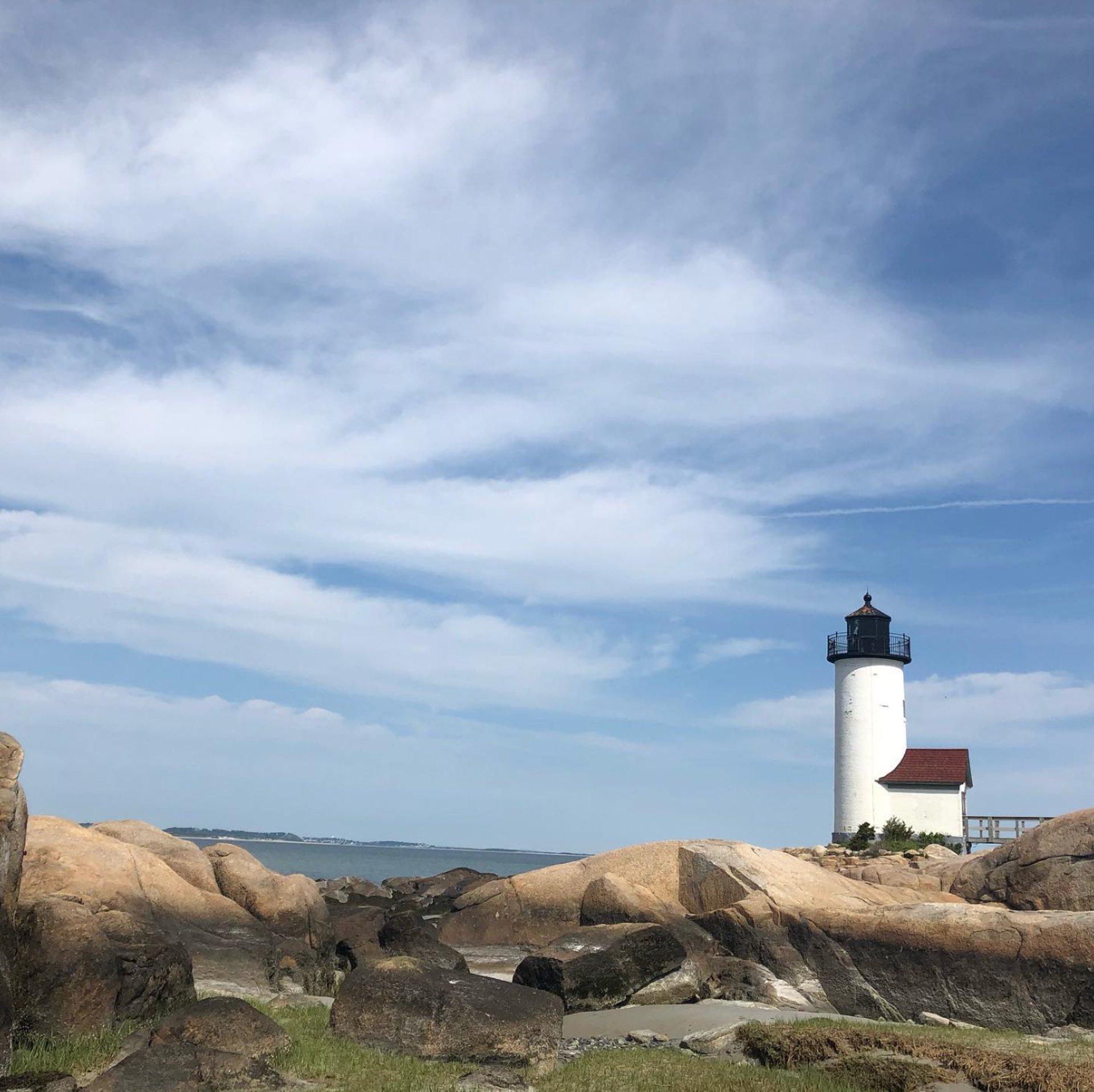 woman wearing yellow long-sleeved dress under white clouds and blue sky during daytime
