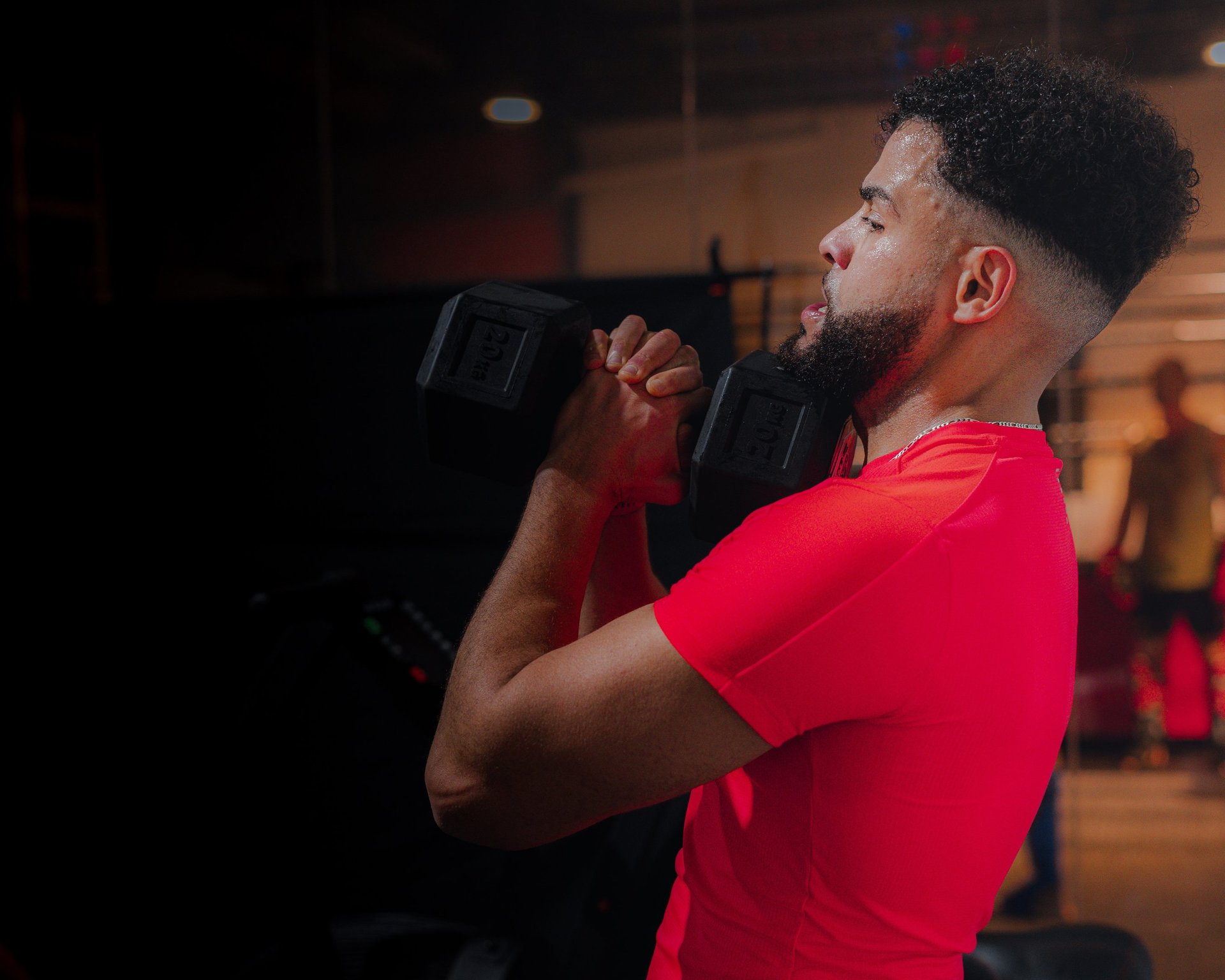 woman with brown hair wearing white and black floral hijab