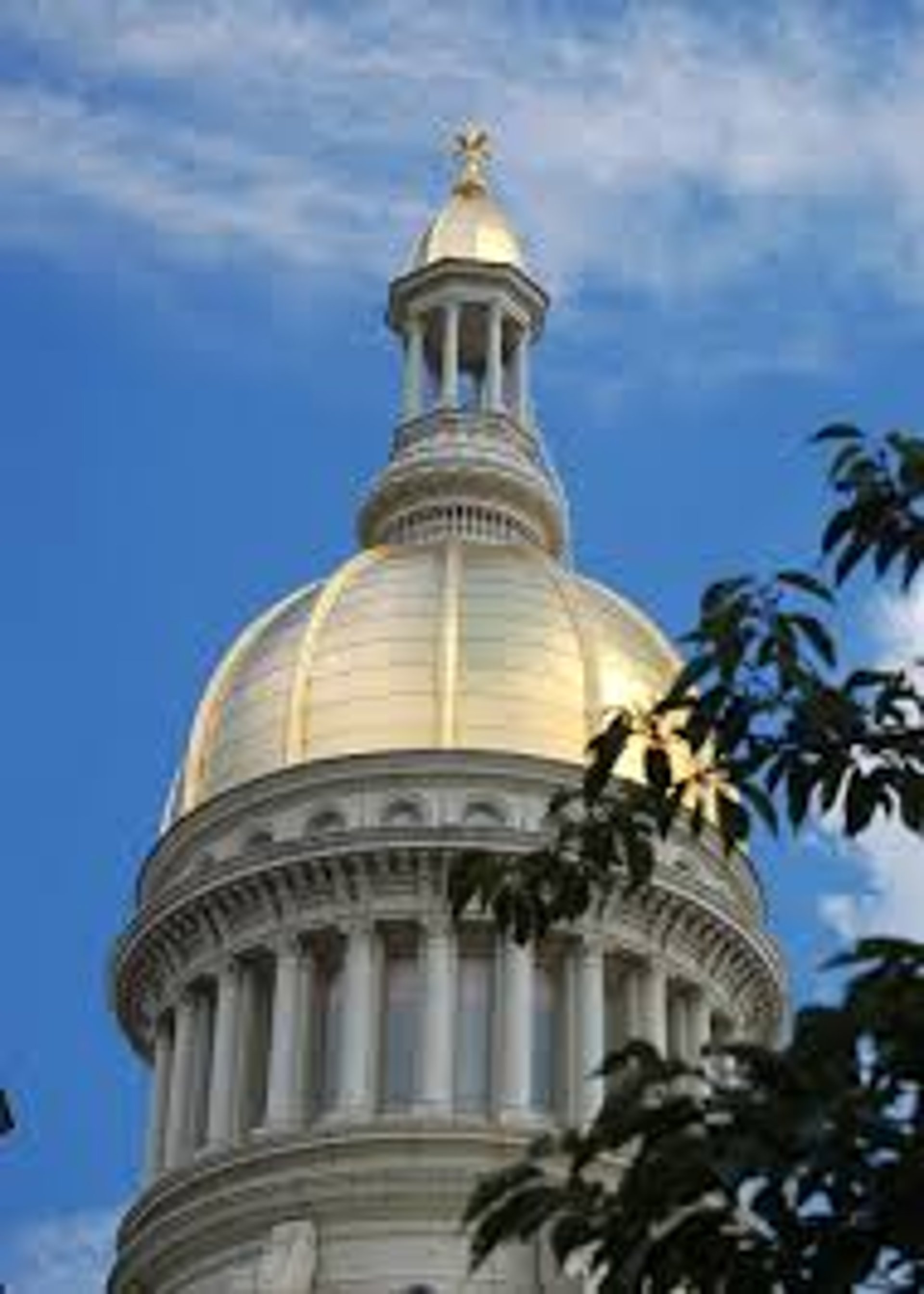 woman wearing yellow long-sleeved dress under white clouds and blue sky during daytime