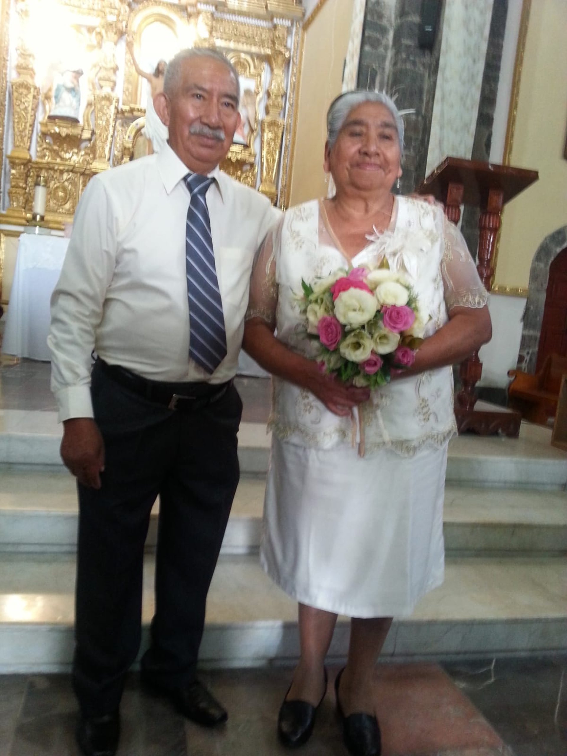 couple wearing silver-colored rings