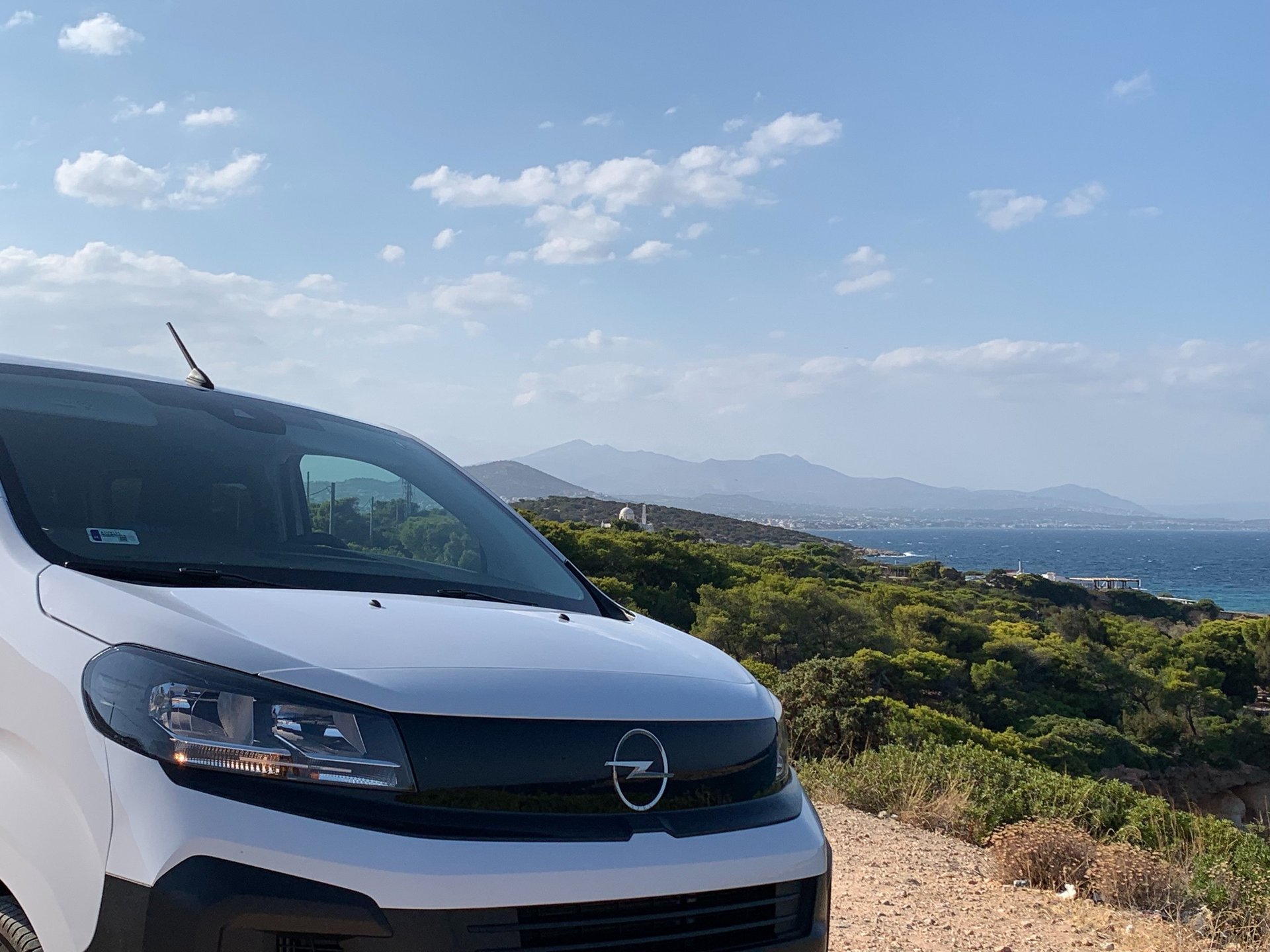 woman wearing yellow long-sleeved dress under white clouds and blue sky during daytime