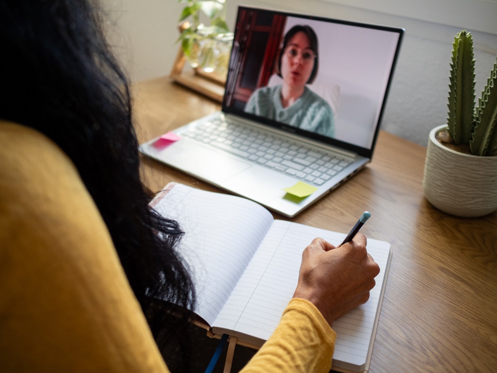 woman wearing yellow long-sleeved dress under white clouds and blue sky during daytime