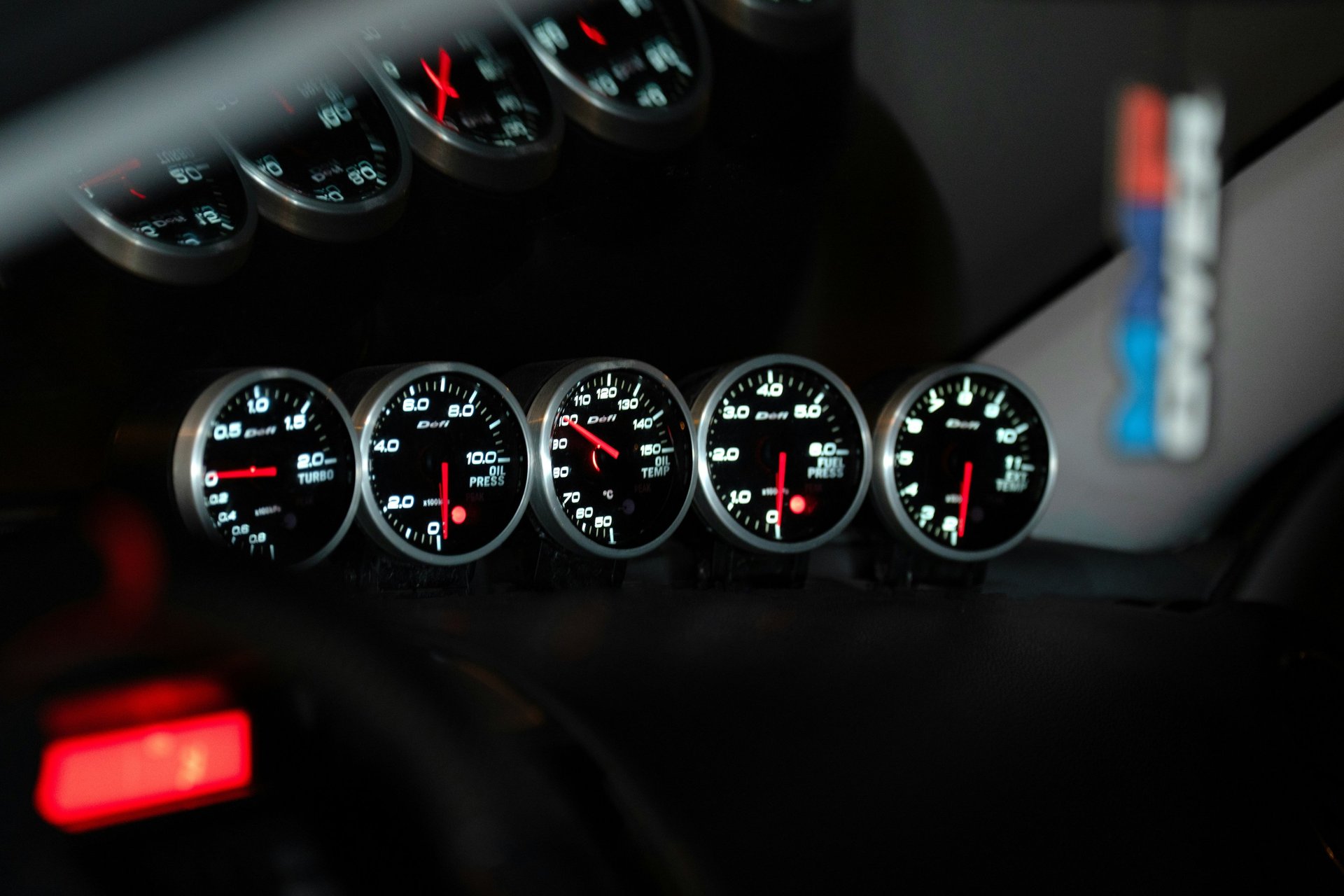 an abstract photo of a curved building with a blue sky in the background