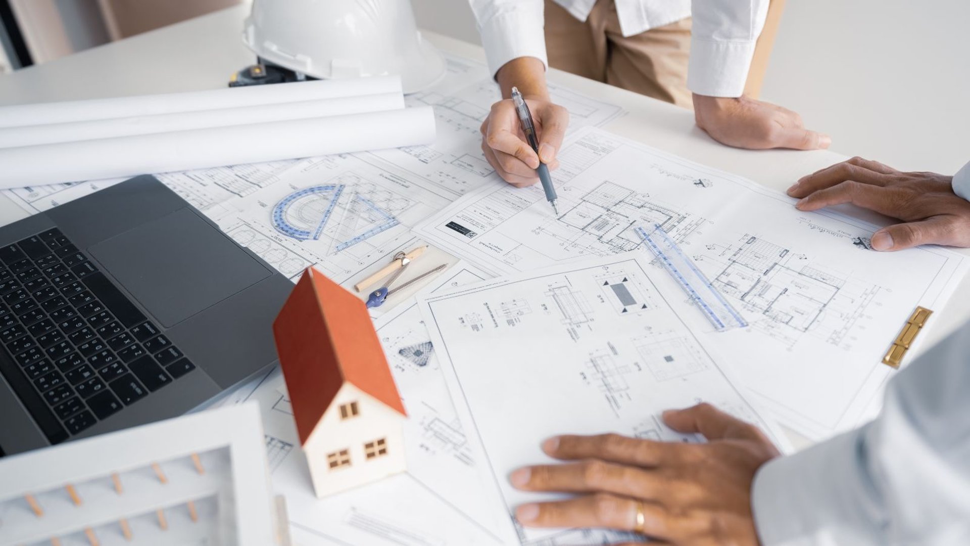 an abstract photo of a curved building with a blue sky in the background