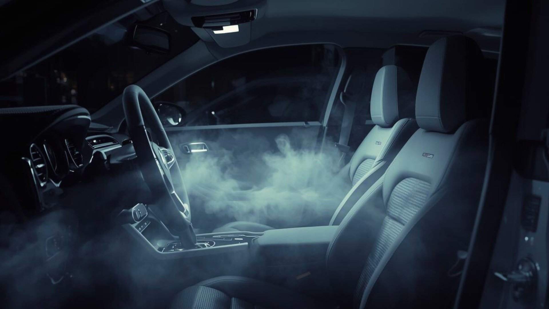 an abstract photo of a curved building with a blue sky in the background